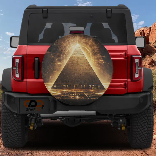 a red Jeep Wrangler with a large, circular decal on the rear window depicting a pyramid with a golden glow at the top.