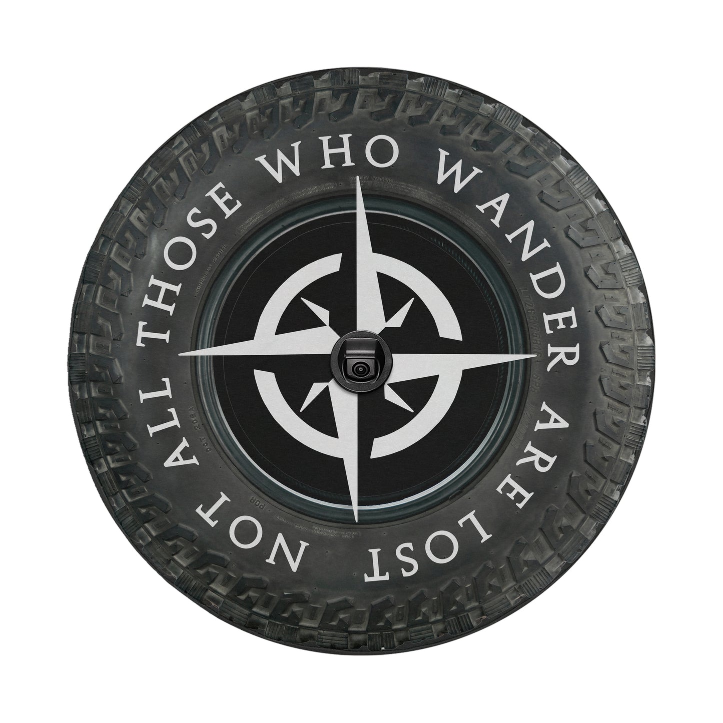 A black and white image of a tire with a compass symbol and the text "ALL THOSE WHO WANDER ARE NOT LOST" printed on it.