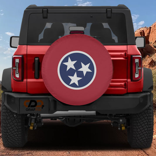 A red Jeep Wrangler with a large tire cover featuring the Tennessee state flag design.