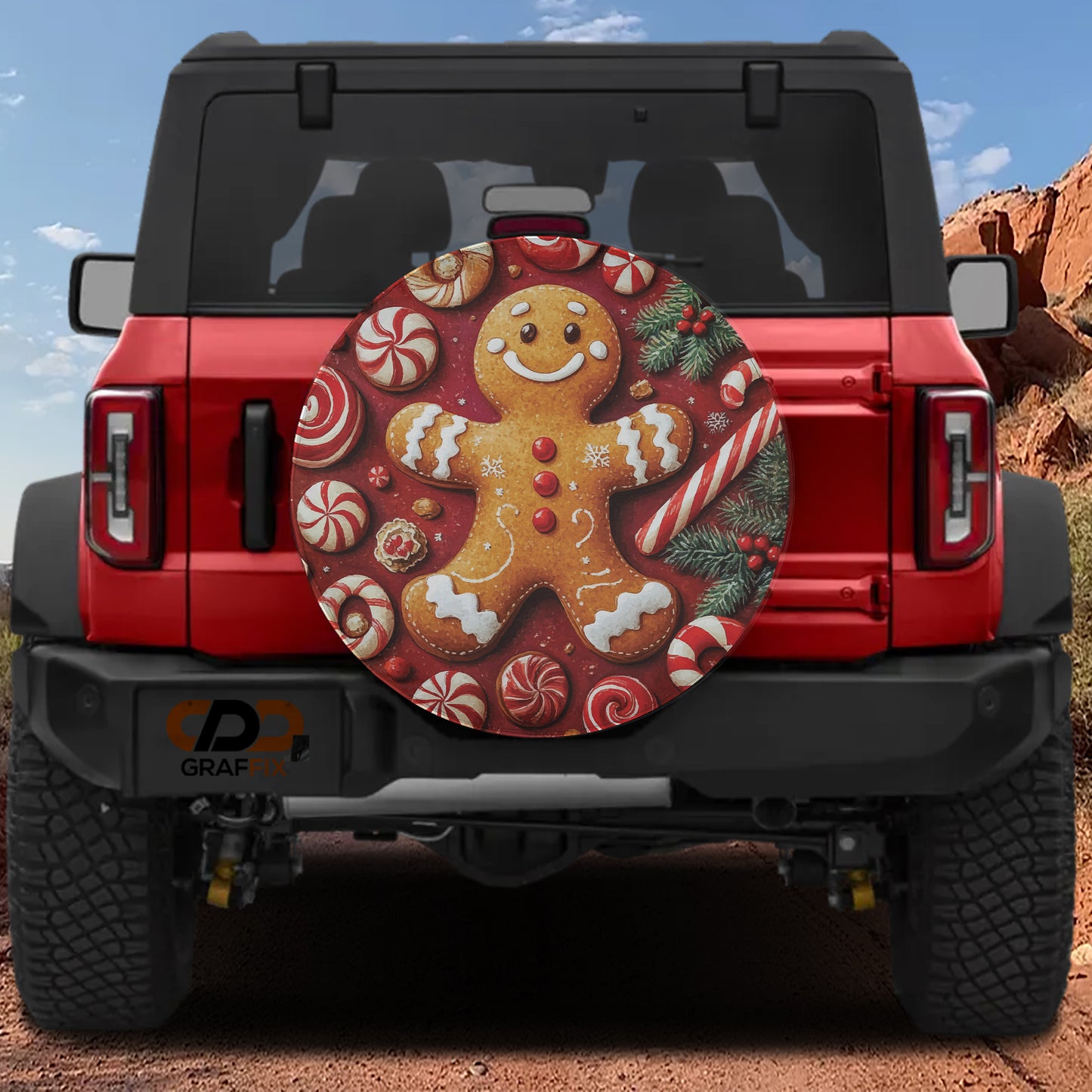 A red Jeep Wrangler with a gingerbread man bumper cover attached to the rear.