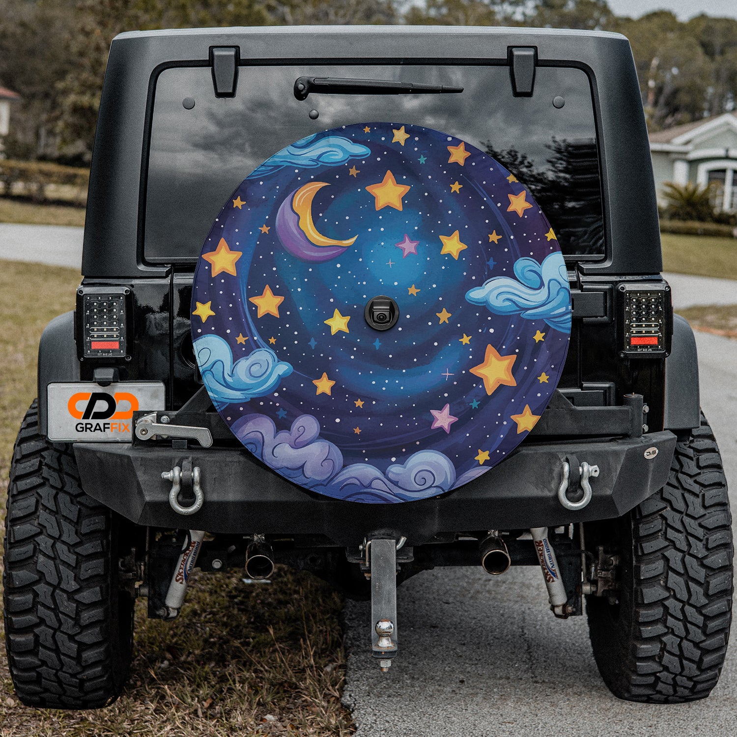 a jeep with a painted moon and stars on it