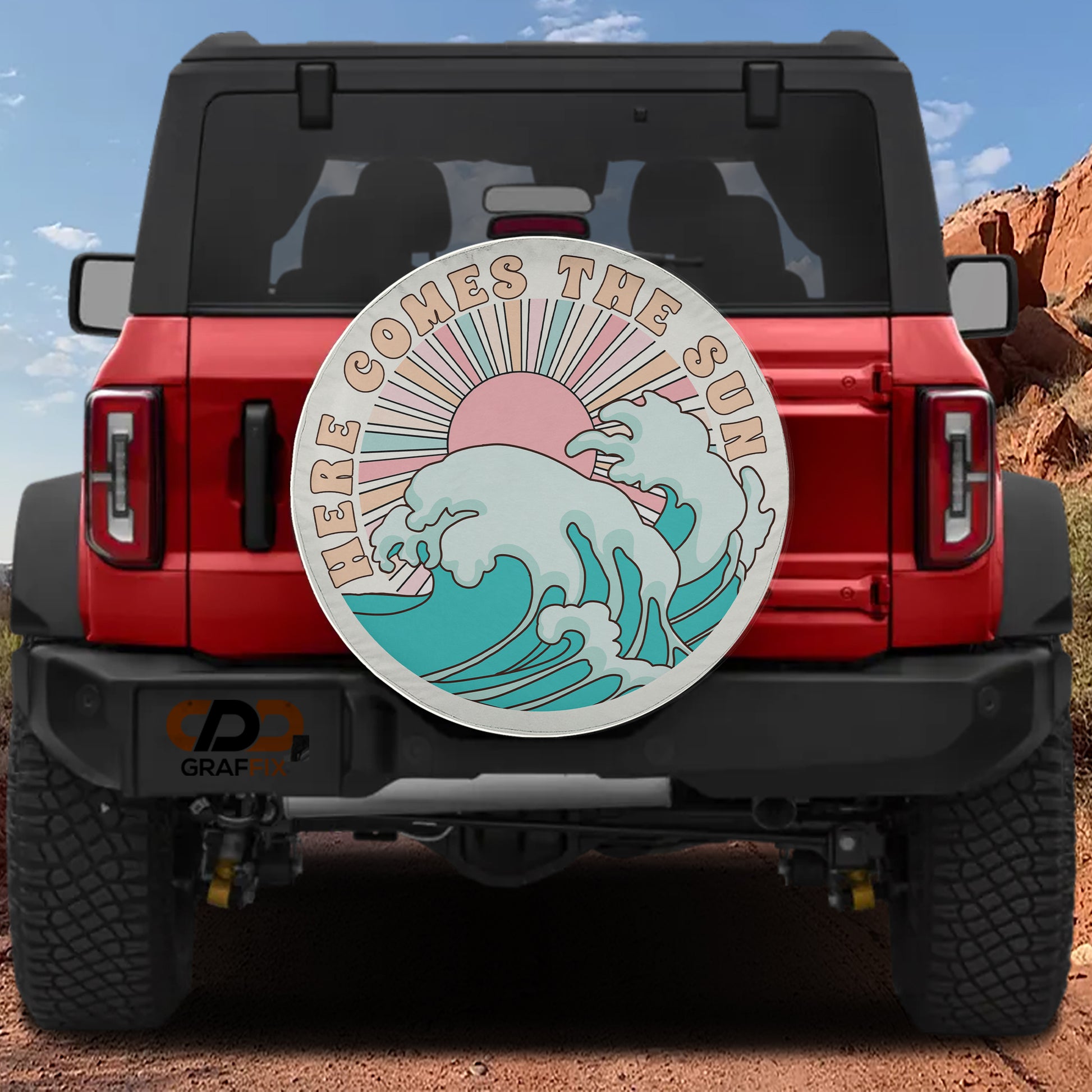a red Jeep Wrangler with a large surfboard-like graphic on the rear window, depicting a wave and the sun.