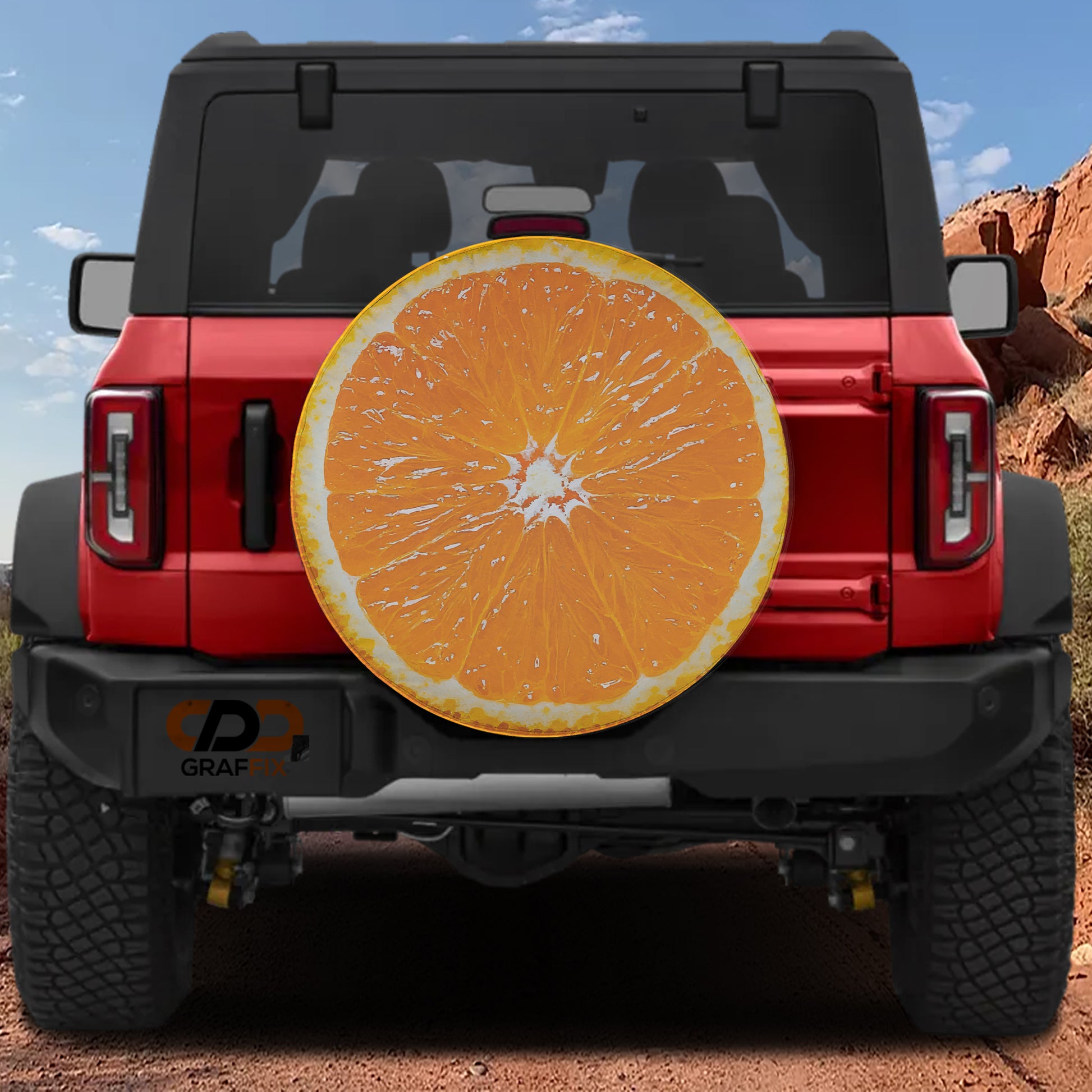 A red Jeep Wrangler with a large orange-colored surfboard-like object attached to the rear of the vehicle.
