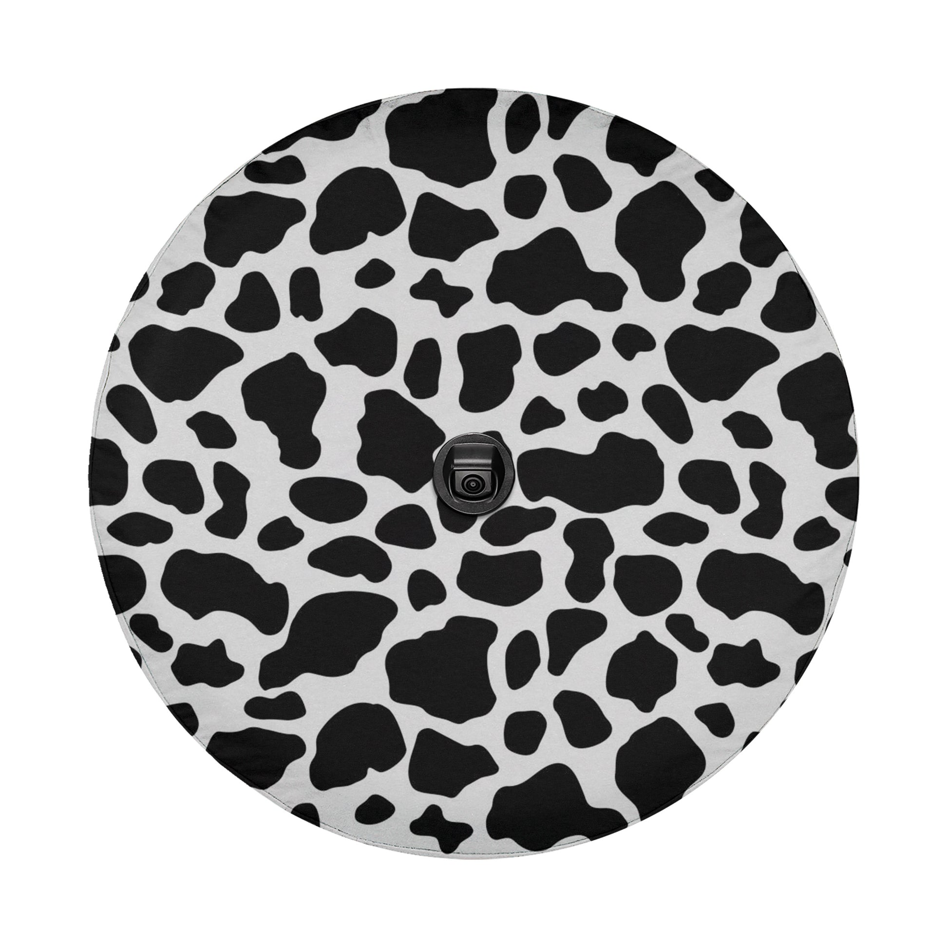 a circular pattern with a black and white cow design.