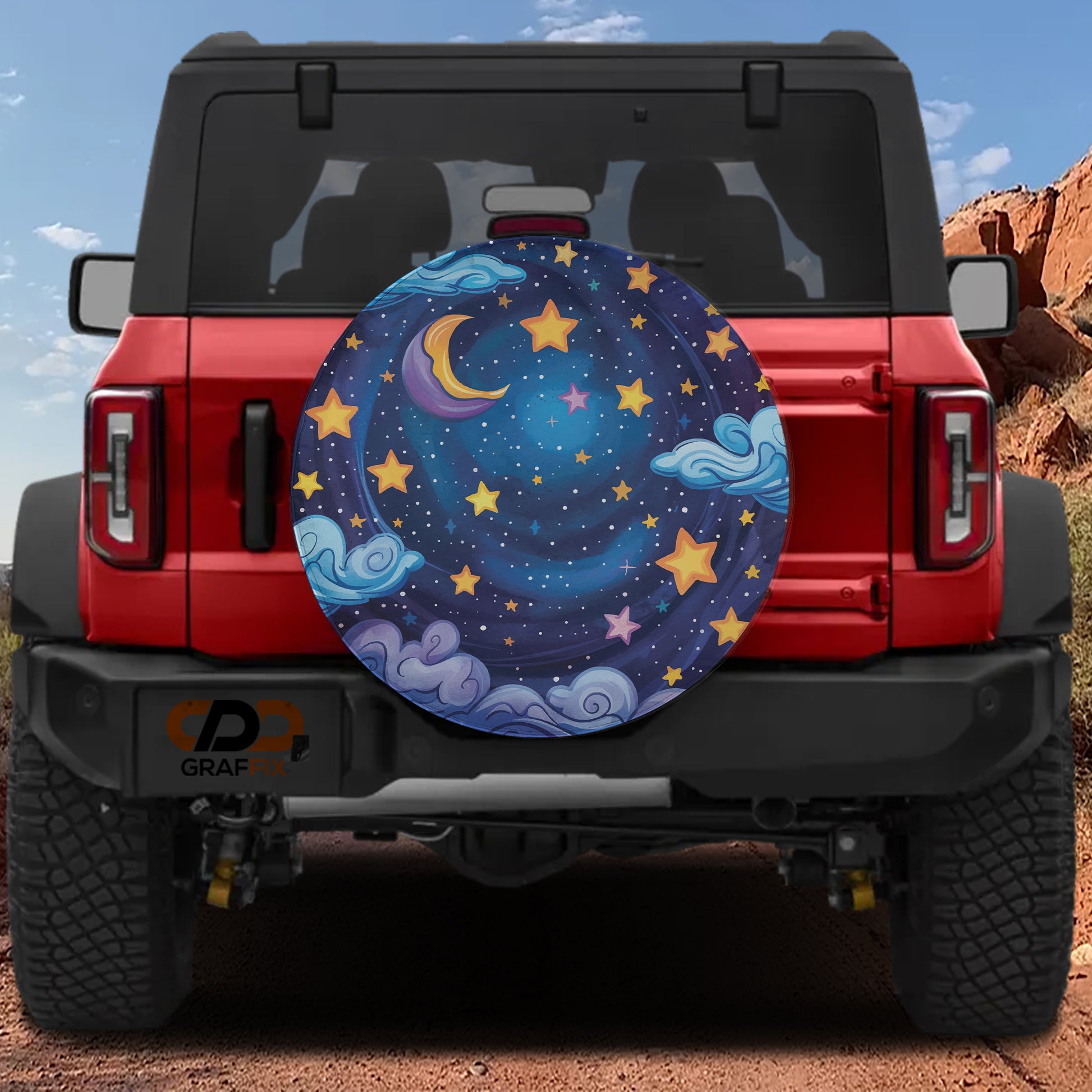 the back of a red Jeep Wrangler with a large, colorful wheel cover featuring a night sky and stars.