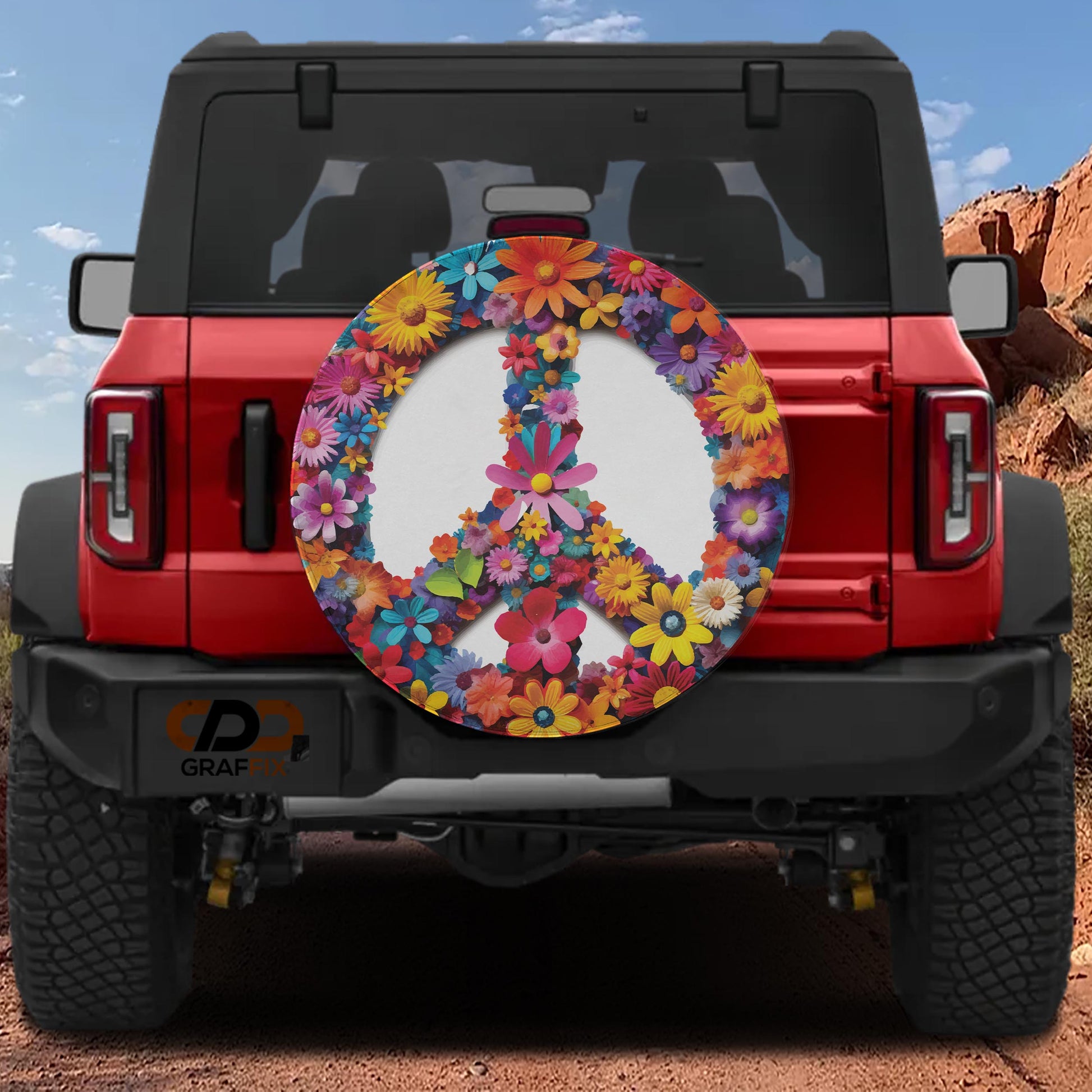A red Jeep Wrangler with a peace sign bumper sticker on the rear.