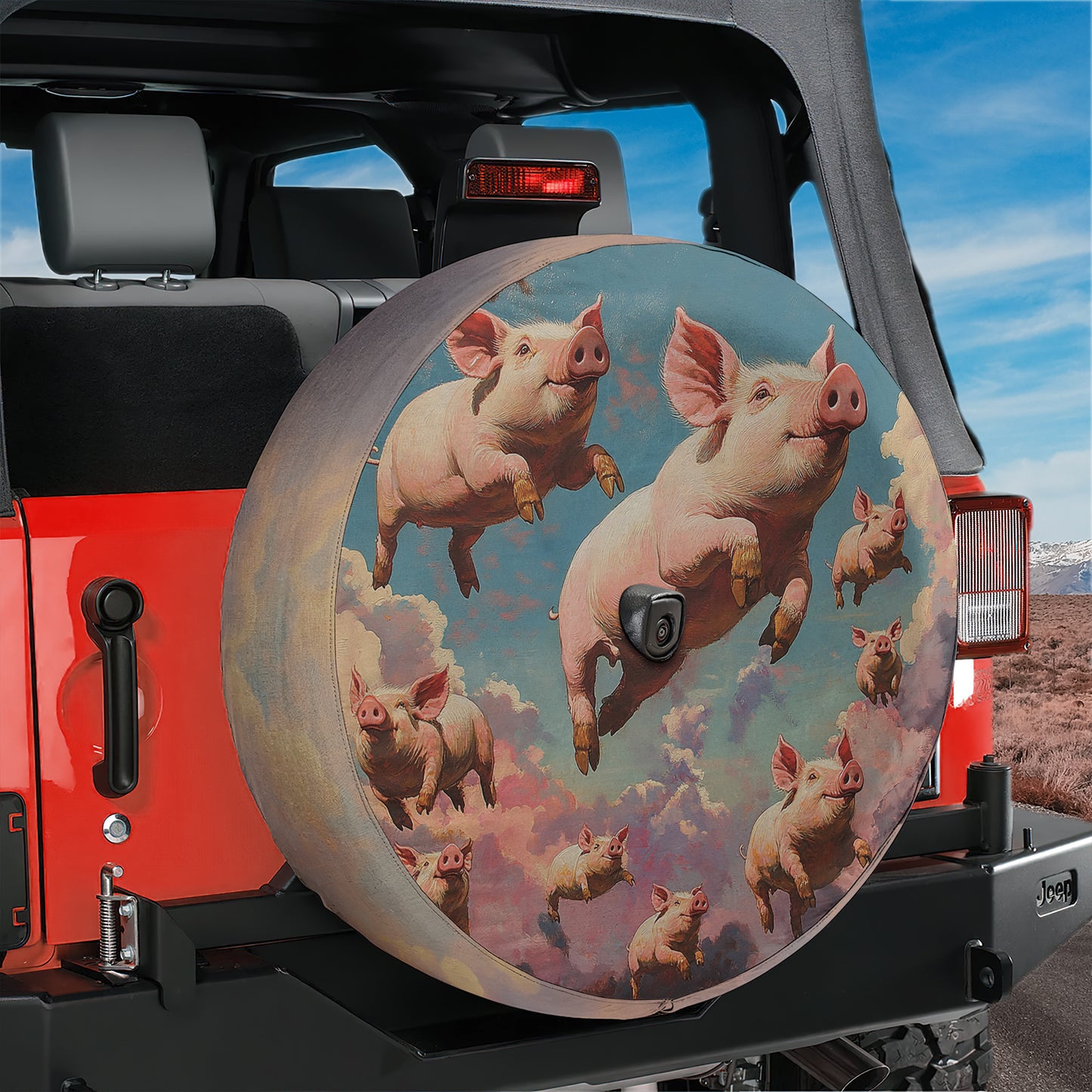 A large, round spare tire cover on a Jeep vehicle, featuring a painting of several pink pigs in the sky.