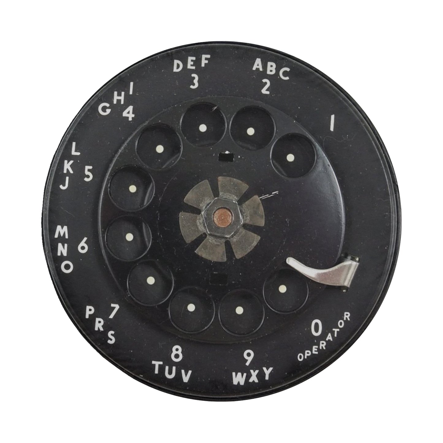 a black rotary dial with white text and numbers, likely used for dialing telephone numbers.