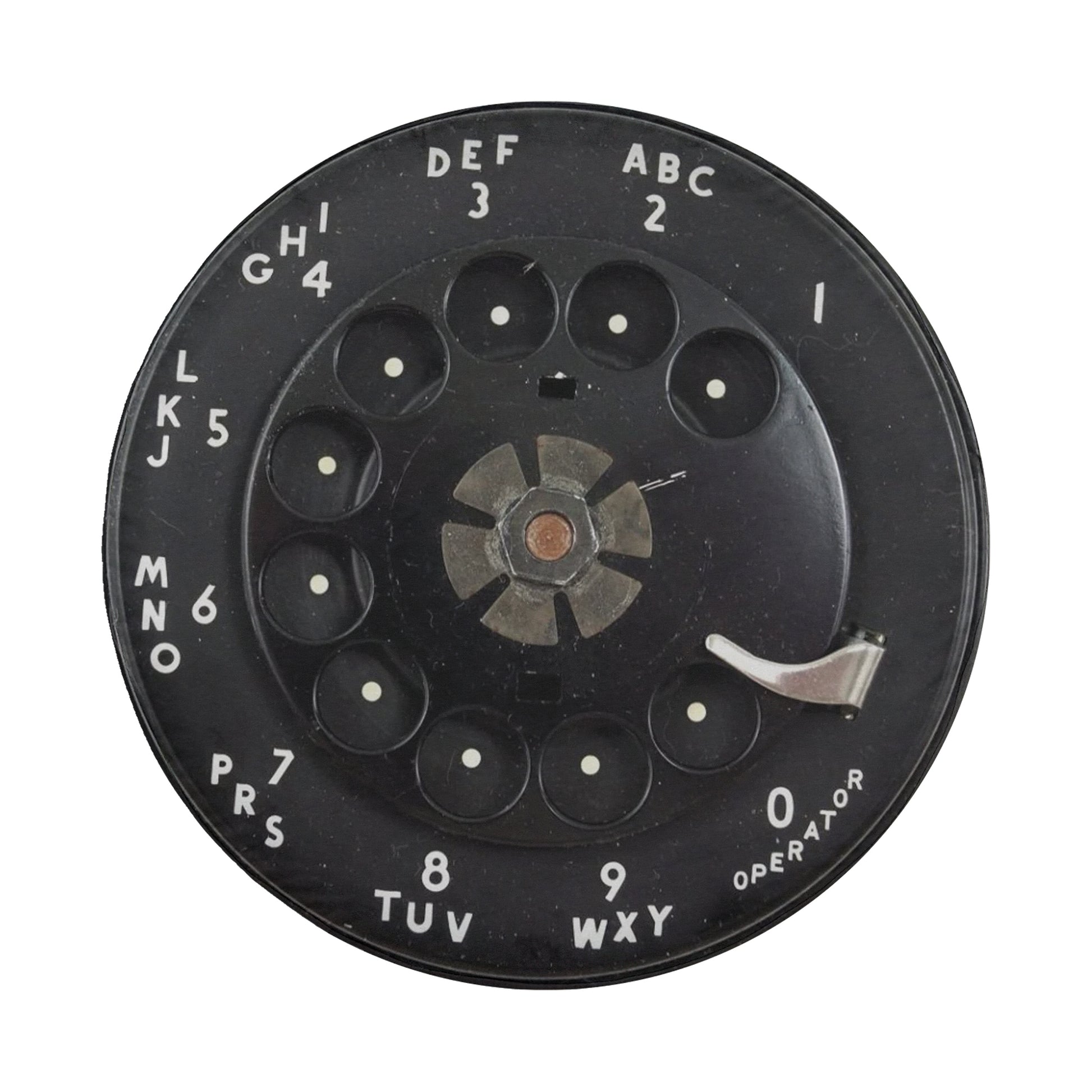 a black rotary dial with white text and numbers, likely used for dialing telephone numbers.