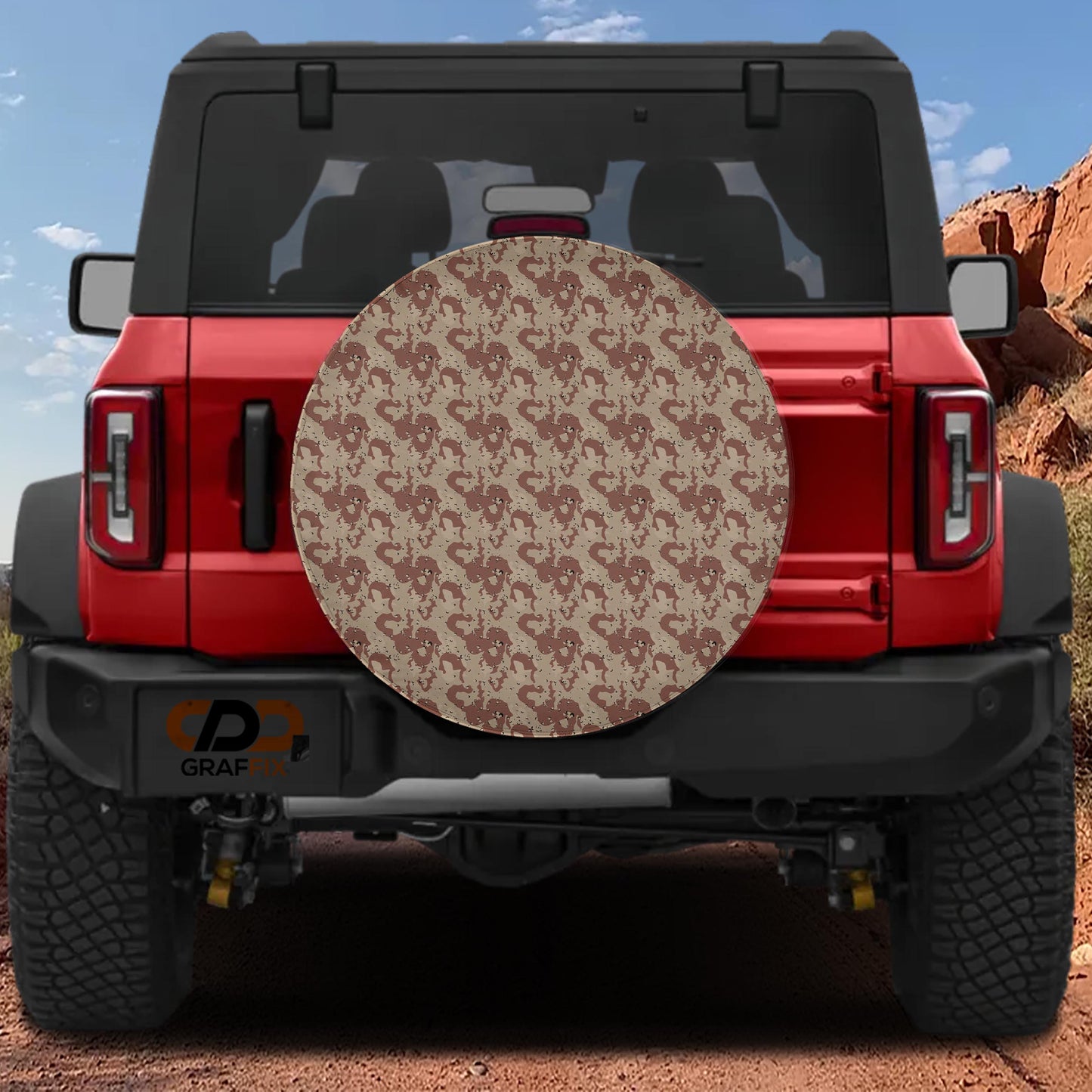 the rear view of a red Jeep Wrangler with a large, circular spare tire cover attached to it.