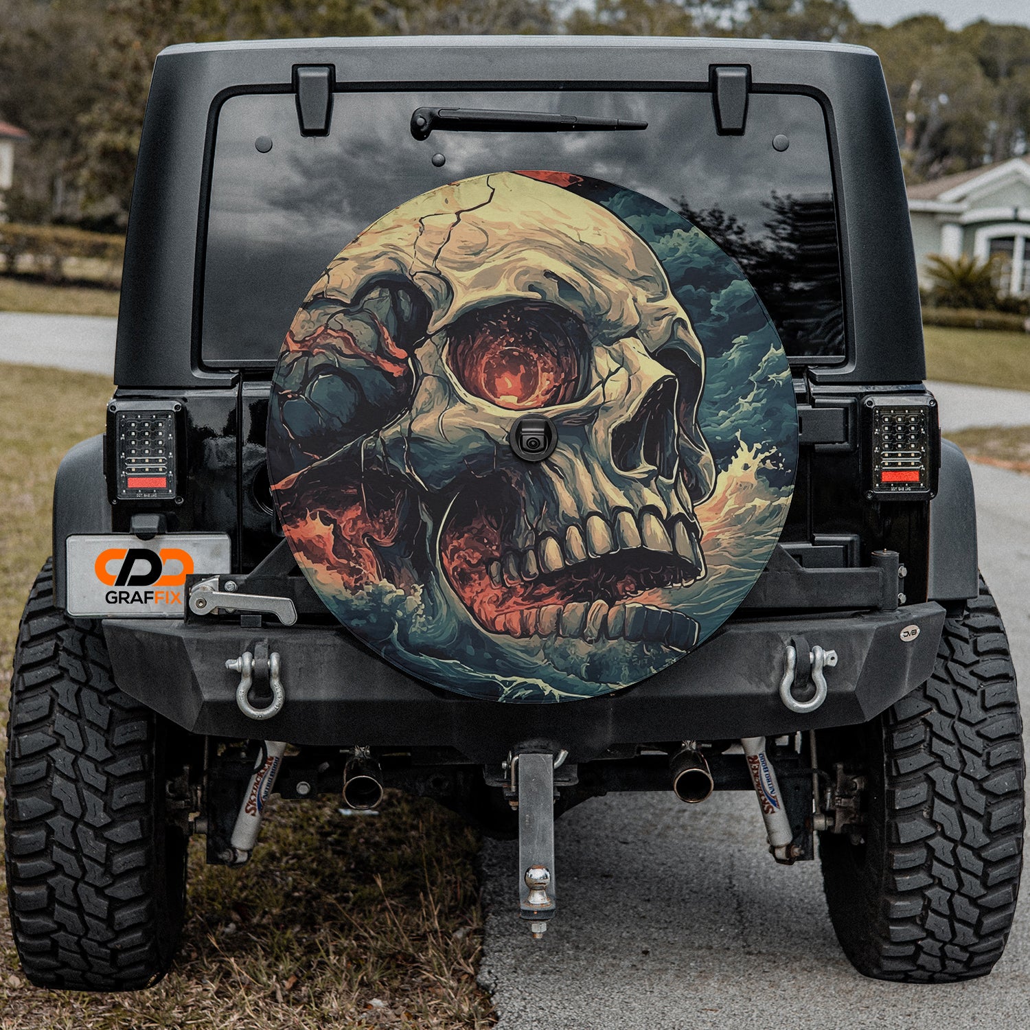 a jeep with a skull painted on the side of it