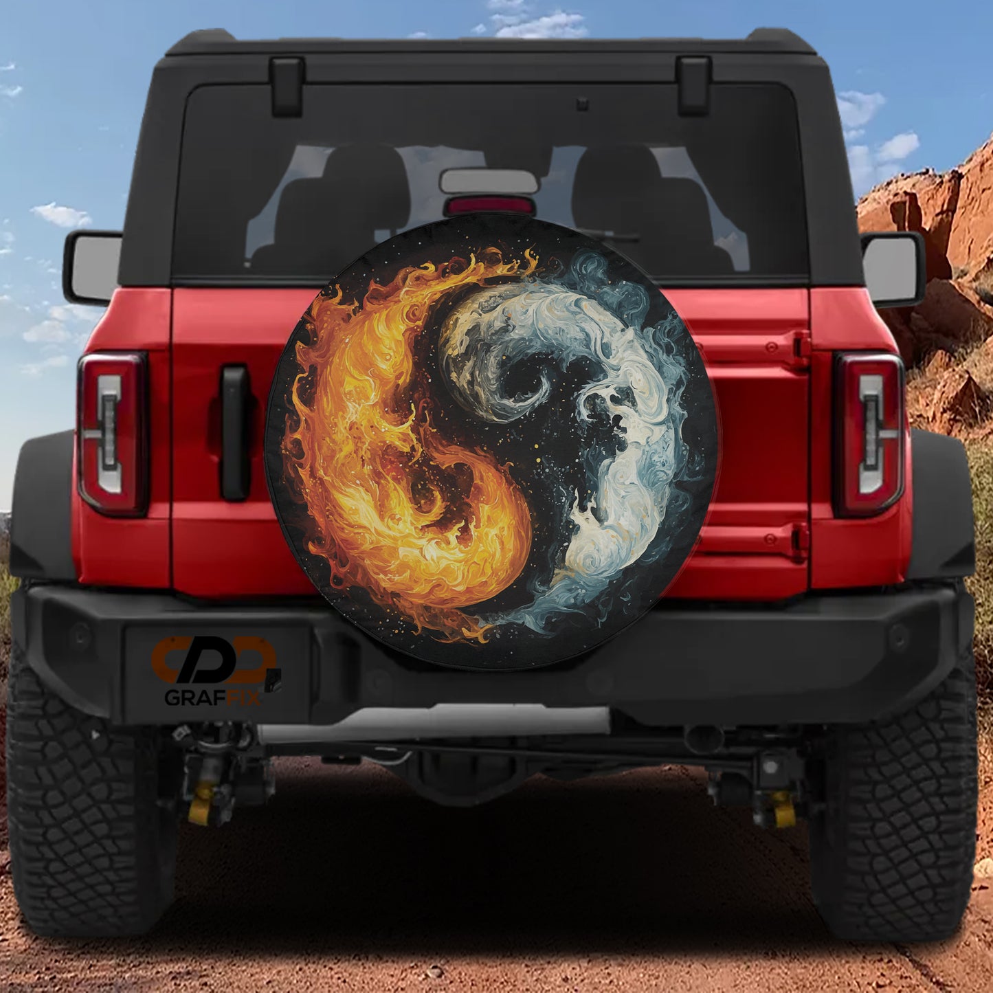 A red Jeep Wrangler with a large, eye-catching wheel cover featuring a yin and yang symbol, depicting the balance between fire and ice.