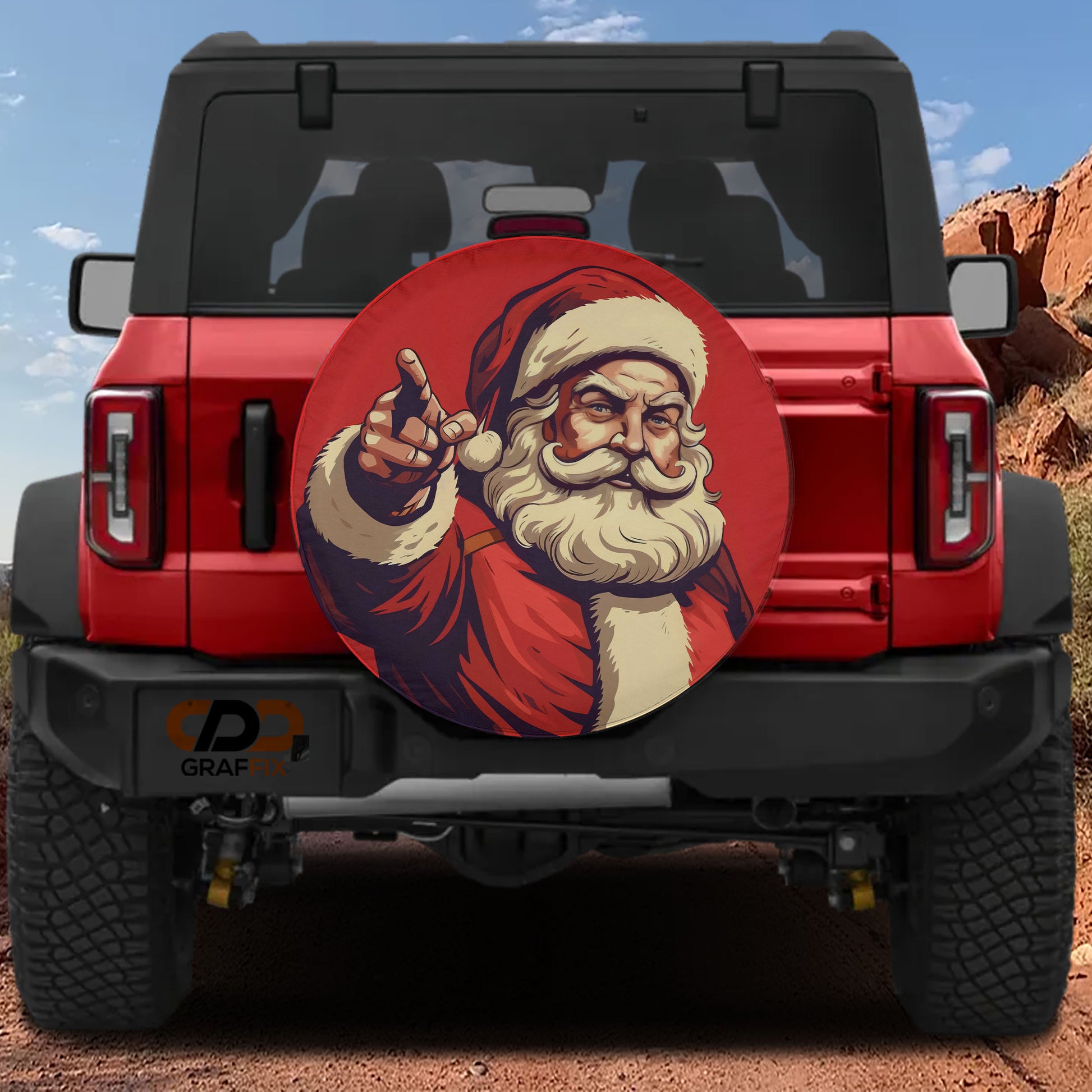 A red Jeep Wrangler with a Santa Claus decal on the rear window.