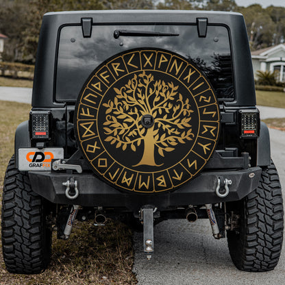 a black jeep with a gold tree of life emblem on it