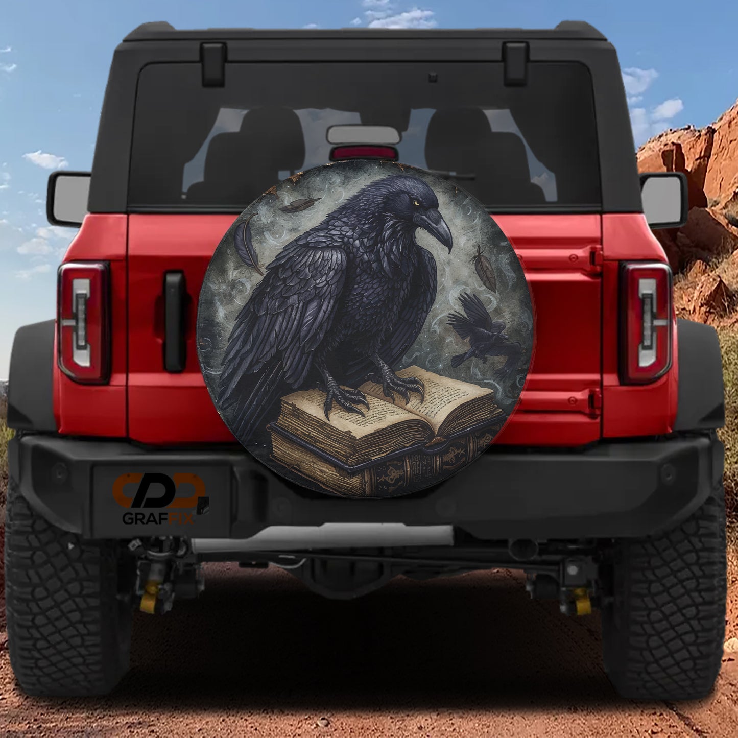 a red Jeep Wrangler with a large, detailed wheel cover depicting a black crow perched on an open book.
