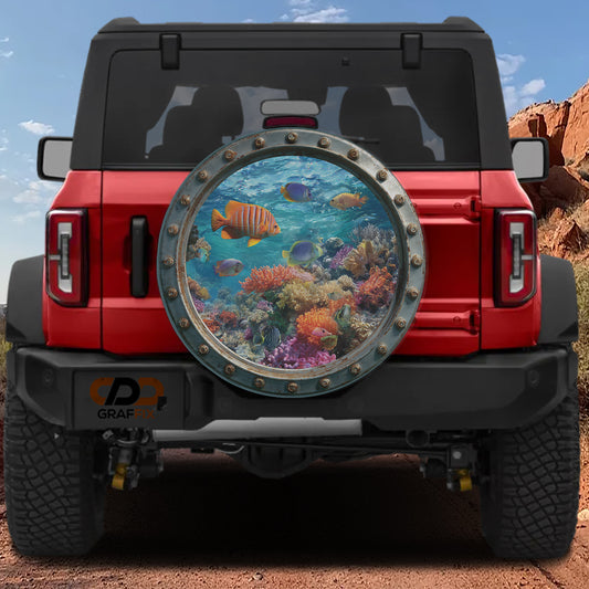 a red Jeep Wrangler with a large round window on the back, displaying a vibrant underwater scene with colorful fish and coral.
