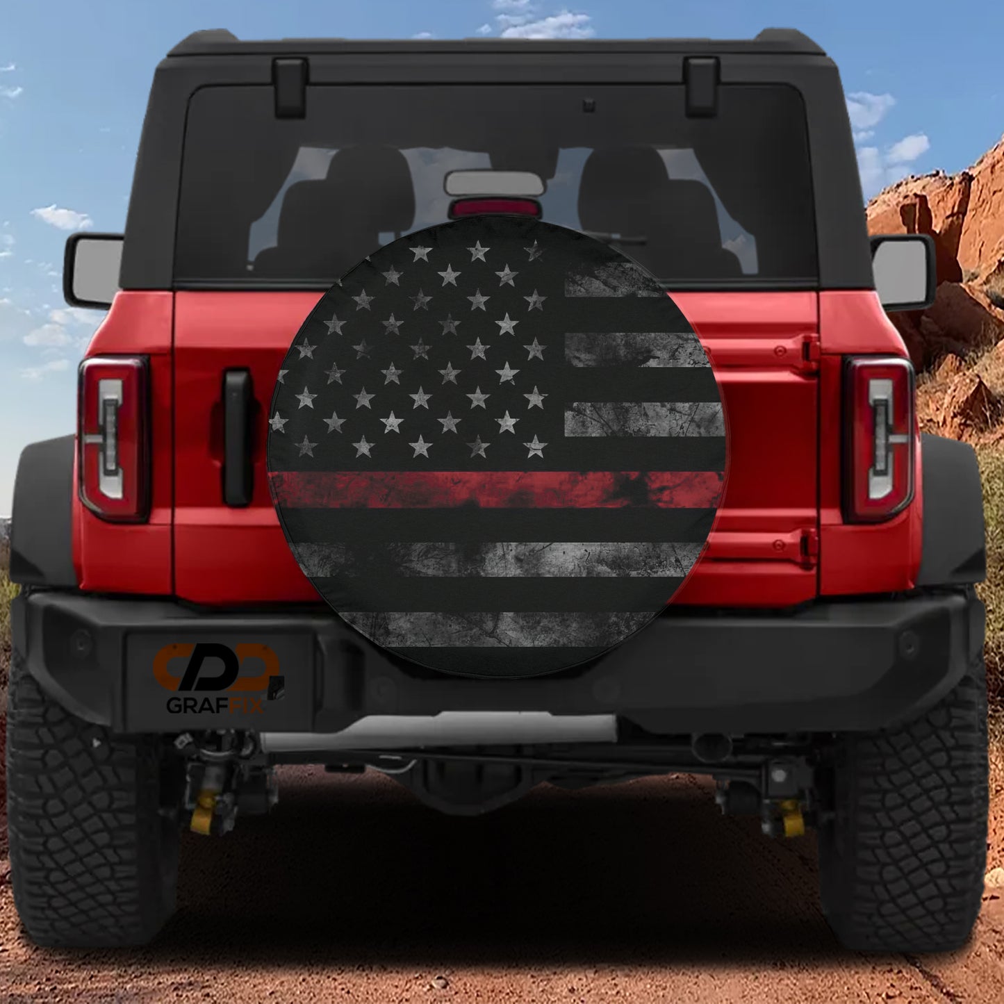 the back of a red Jeep Wrangler with a large American flag decal on the rear window.