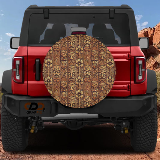 the rear of a red Jeep Wrangler with a large, decorative tiki-style cover on the rear window.