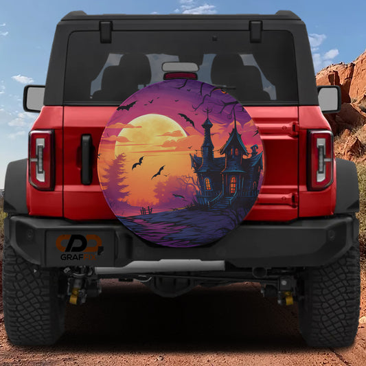 a red Jeep Wrangler with a large, colorful wheel cover depicting a spooky castle scene at night.