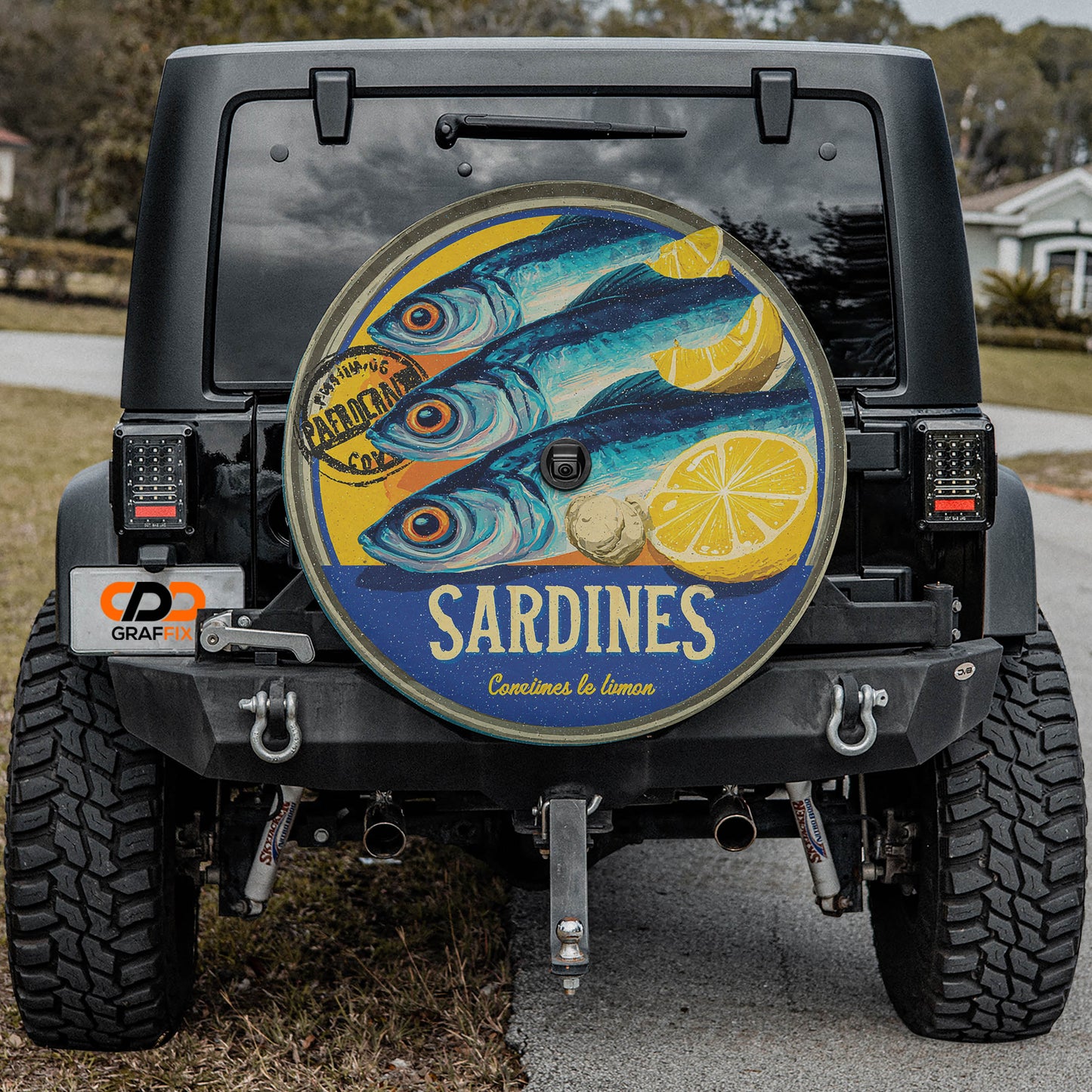 the rear of a black jeep with a large, colorful fish decal on the rear window.