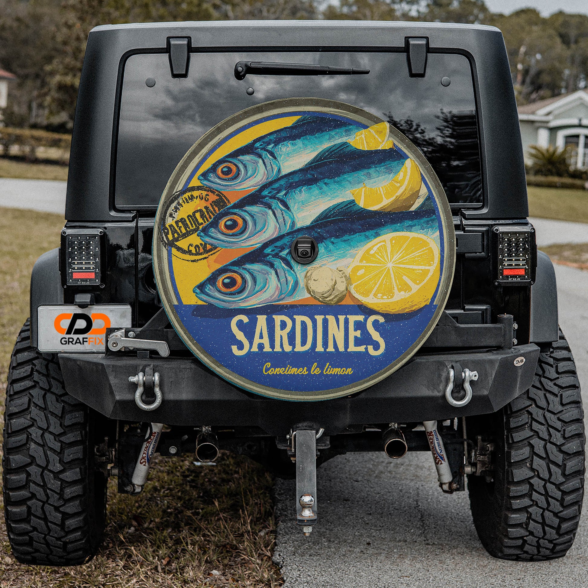 the rear of a black jeep with a large, colorful fish decal on the rear window.