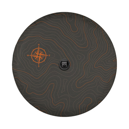 a black and orange circular object with a compass on it