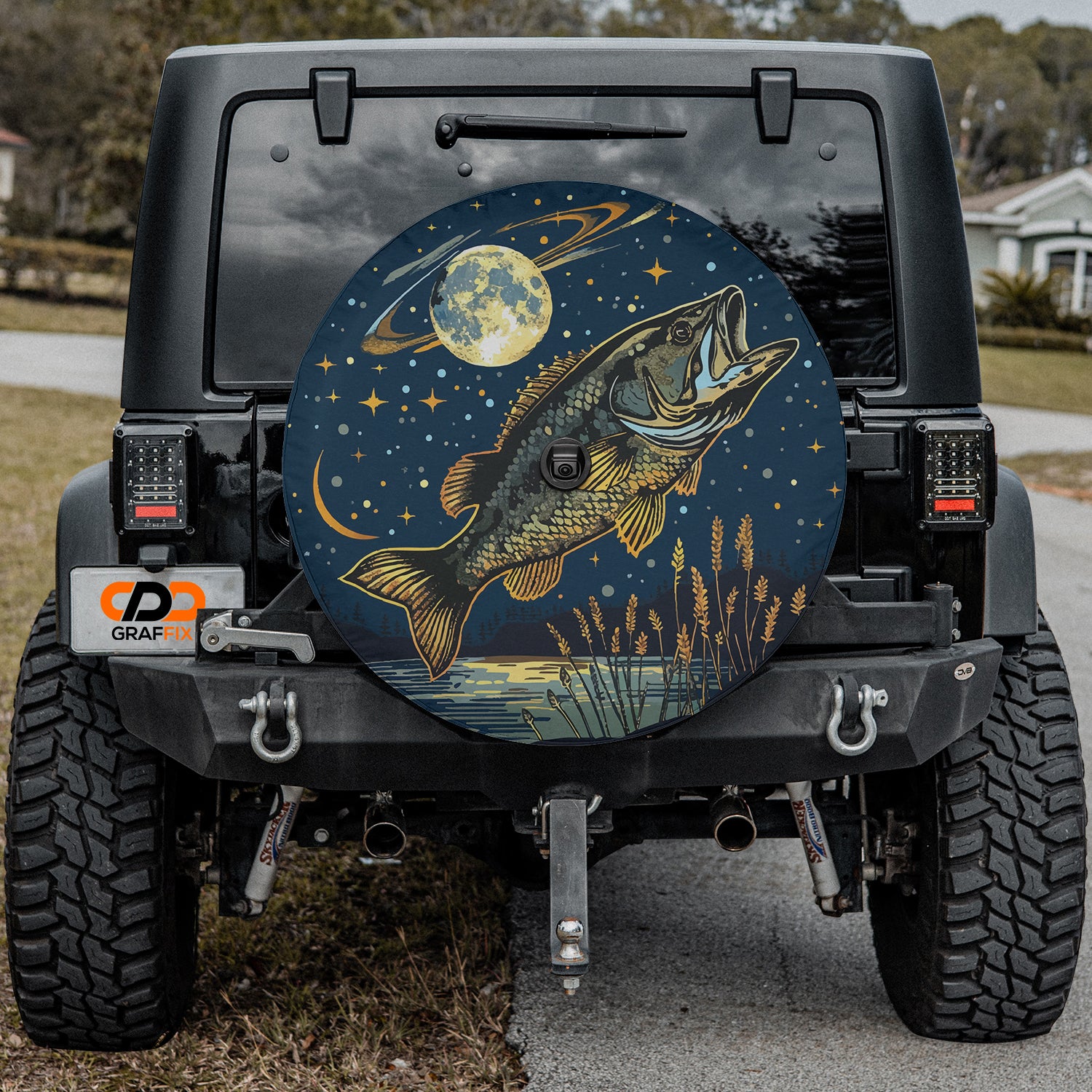 a large fish painted on the back of a jeep