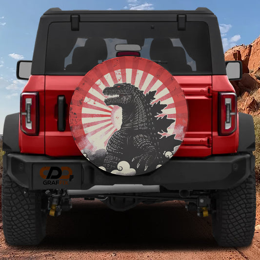 A red Jeep Wrangler with a large Godzilla sticker on the rear window.