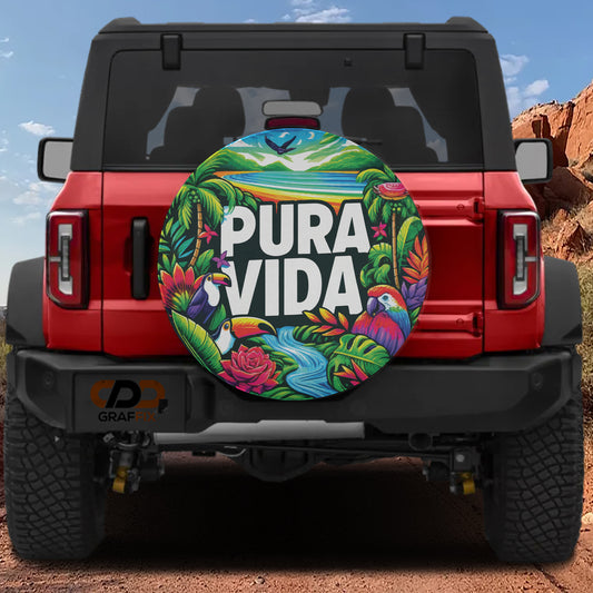 a red Jeep Wrangler with a colorful, tropical-themed spare tire cover on the rear of the vehicle.