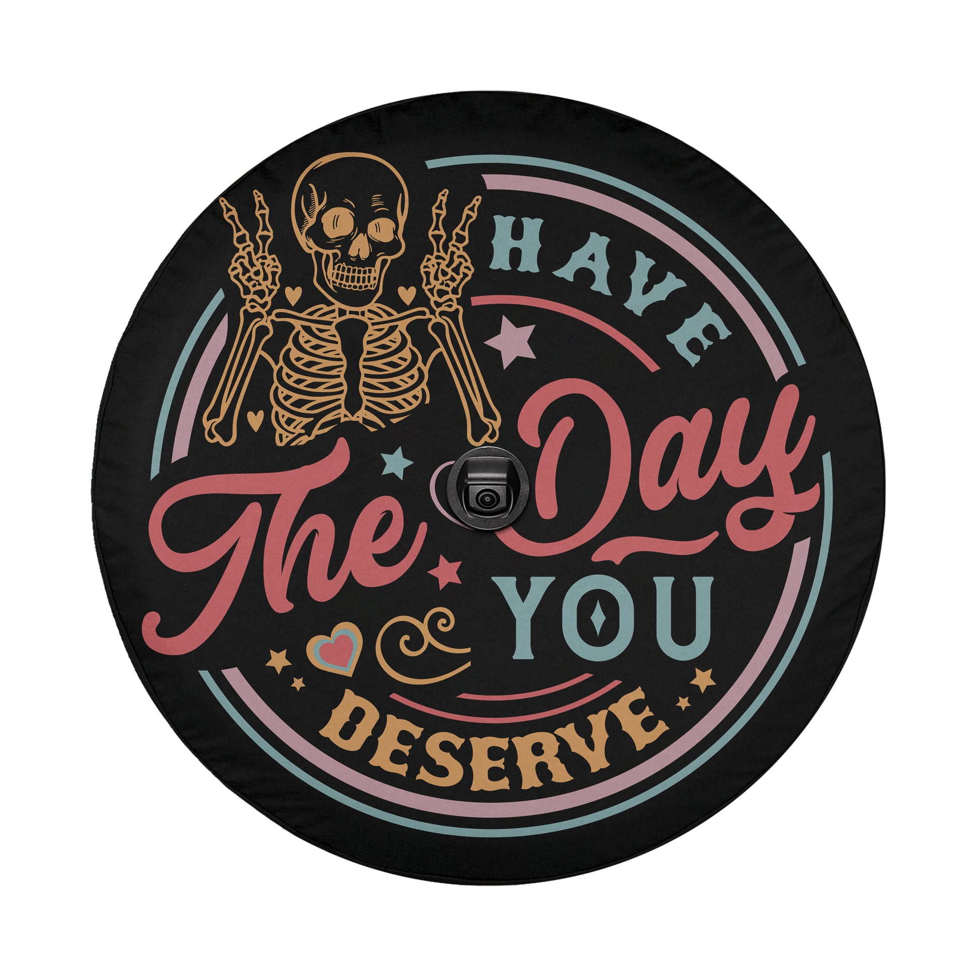 a black wheel cover with a skeleton and text that says "The day you deserve".