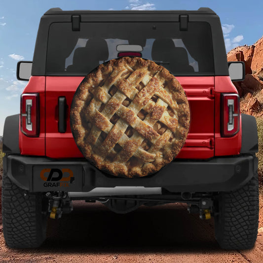 a red Jeep Wrangler with a pie-shaped spare tire attached to the rear of the vehicle.