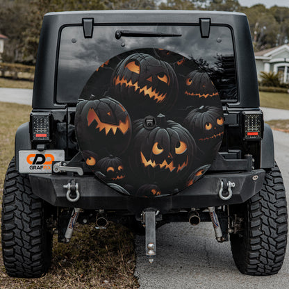 a black Jeep Wrangler with a Halloween-themed spare tire cover featuring a group of jack-o-lanterns.