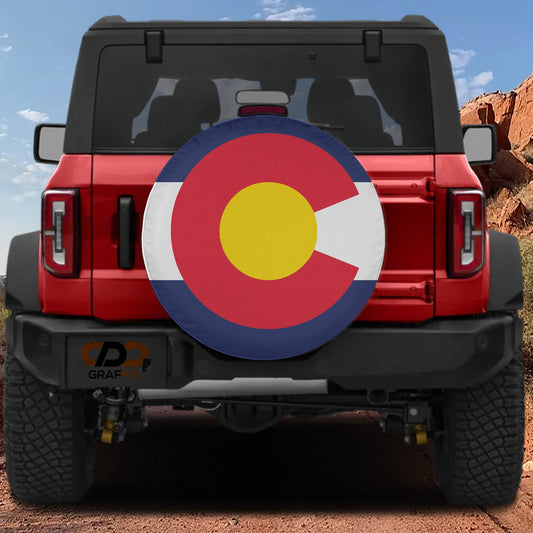 A red Jeep Wrangler with a Colorado state flag decal on the rear window.