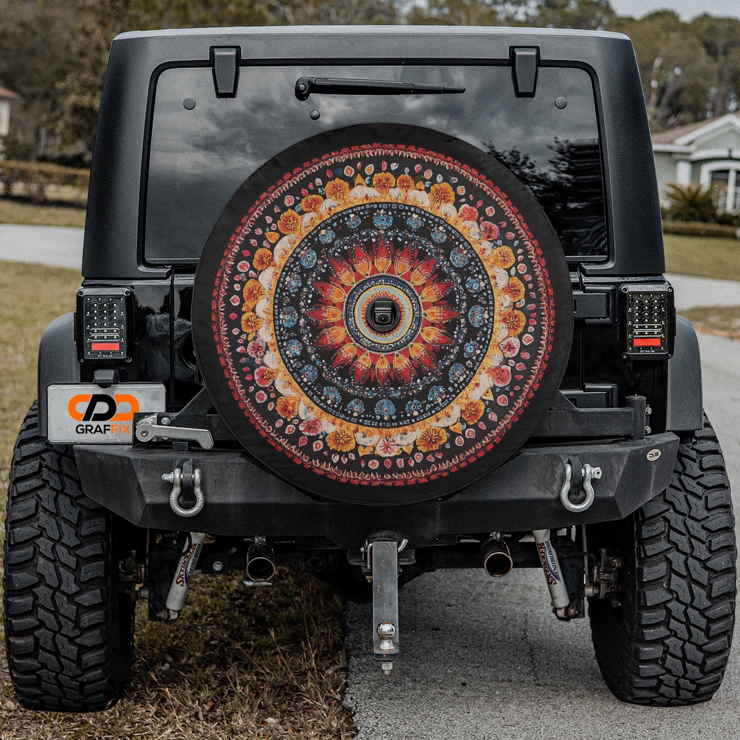 a black jeep with a colorful wheel design on it