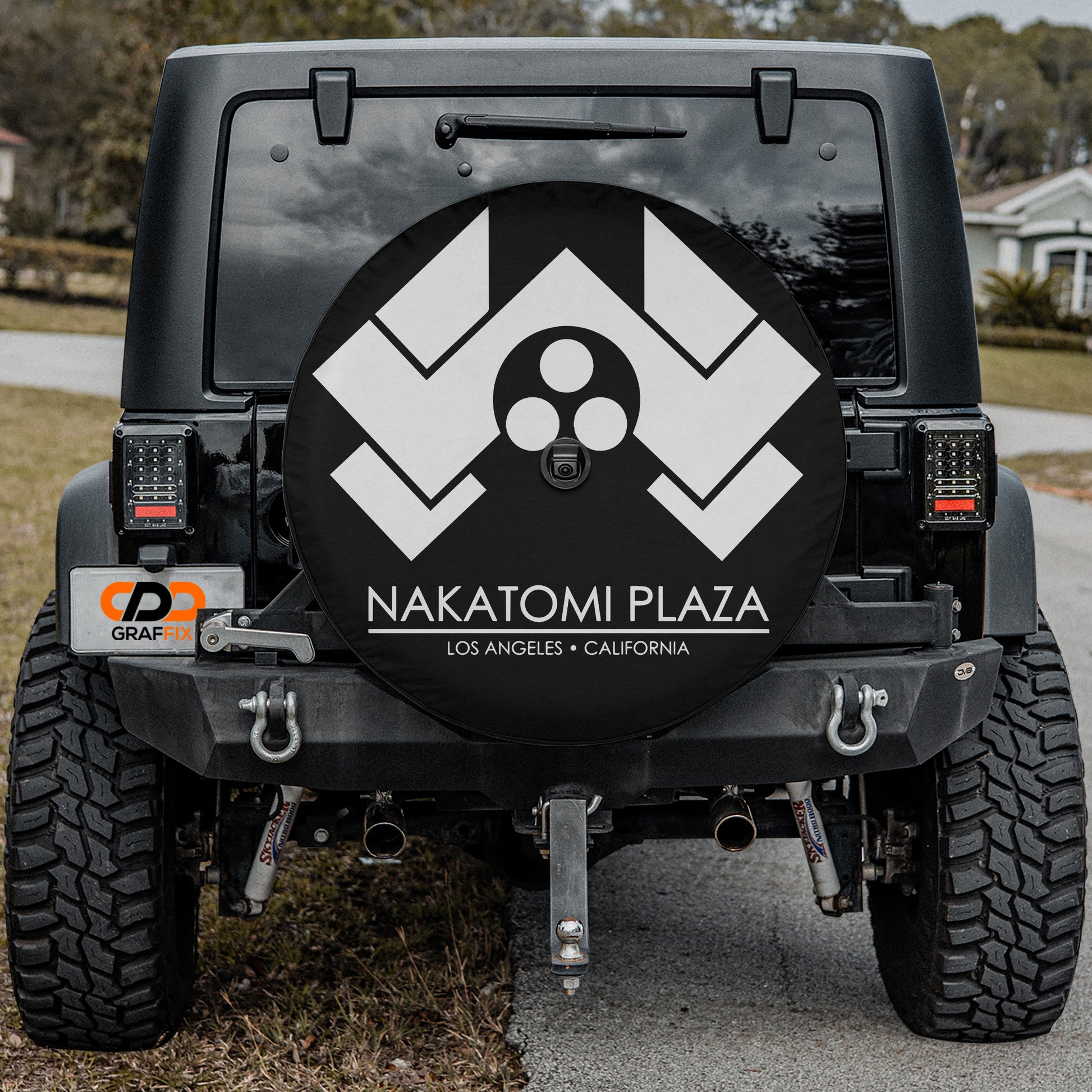 a black jeep with a white logo on it