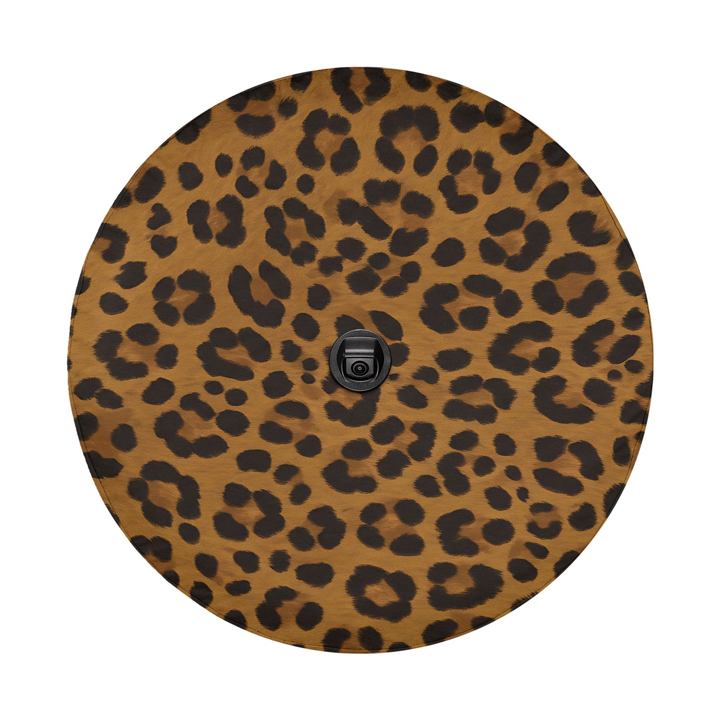 a round, leopard print surface with a black object in the center.