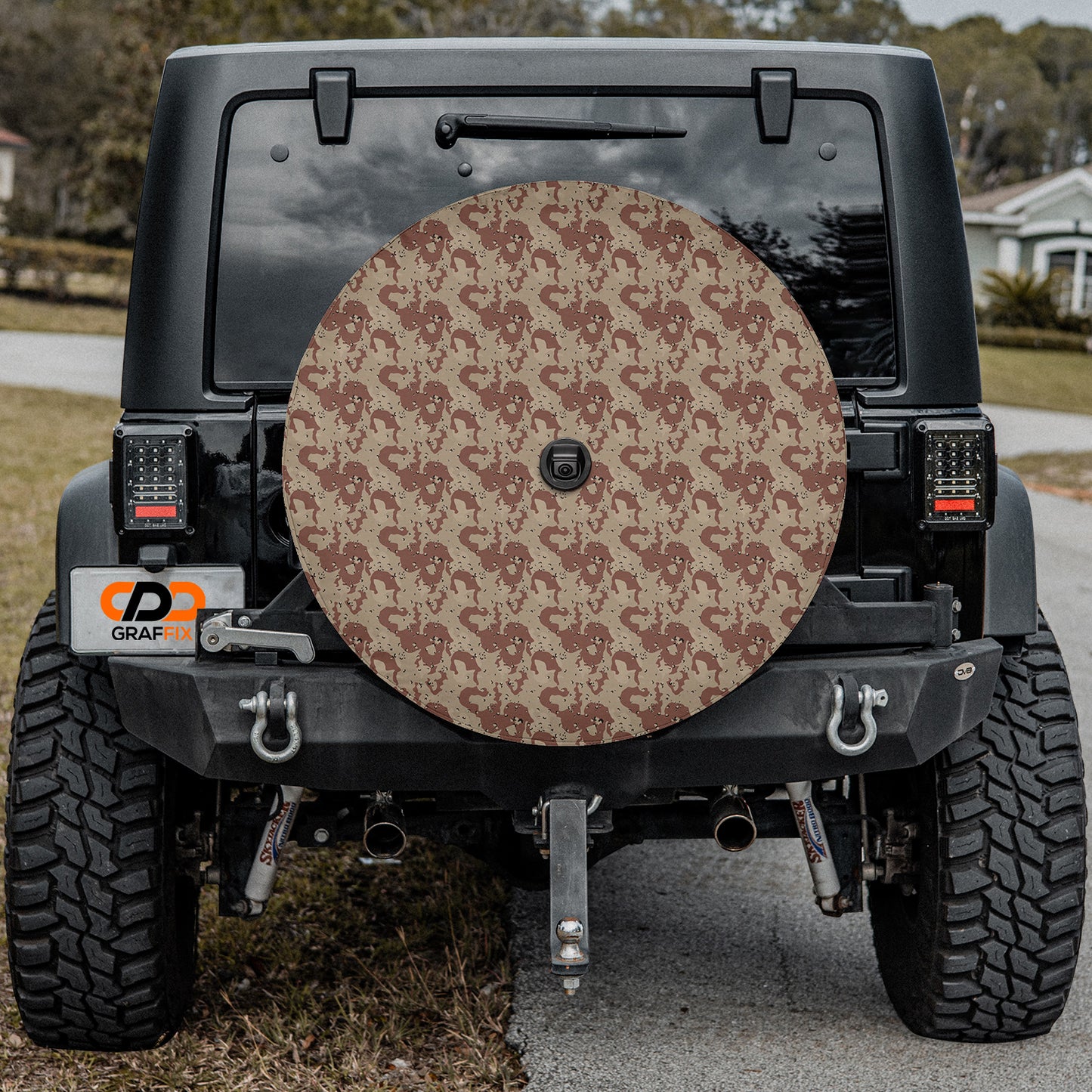 a jeep with a large tire cover on the back of it