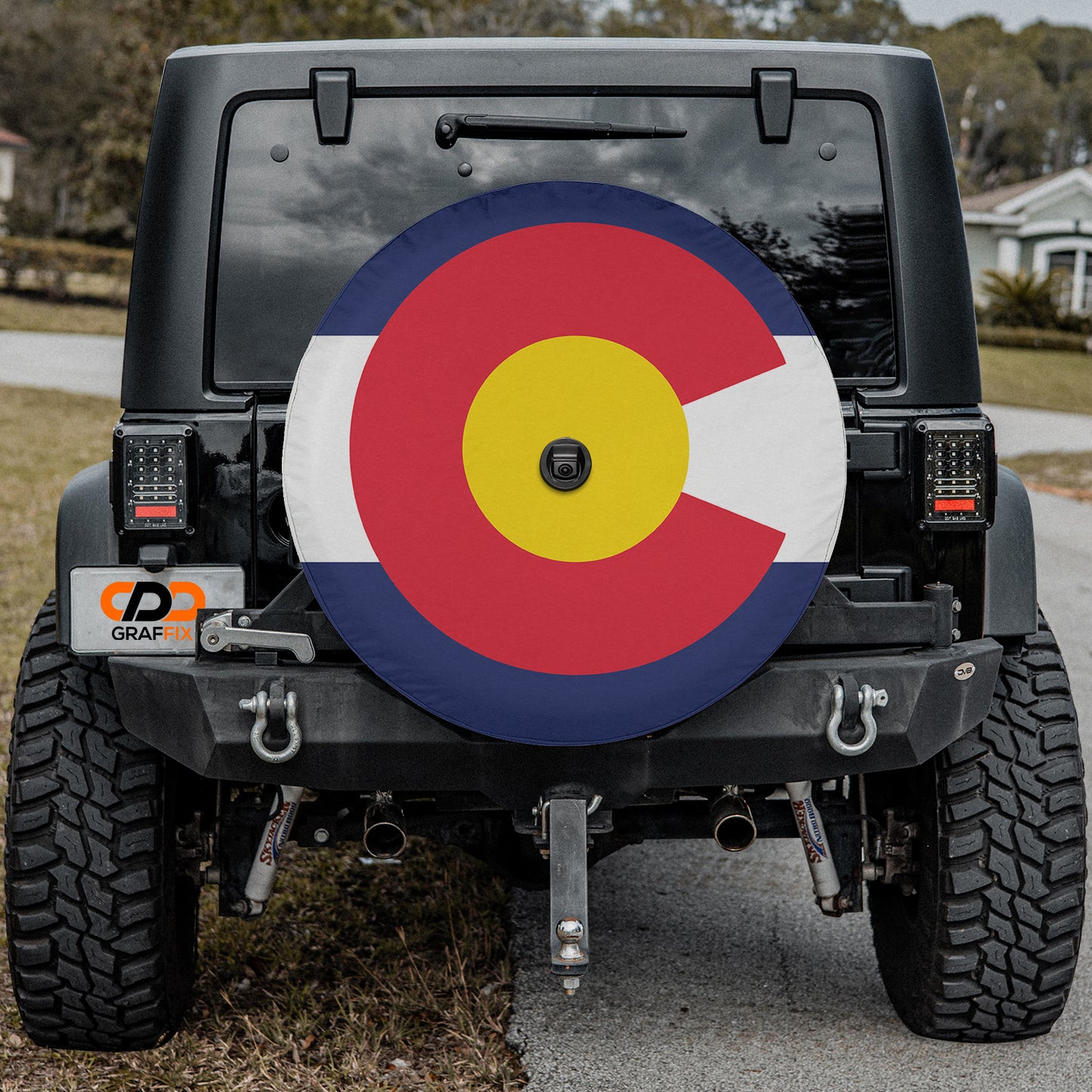 a jeep with the flag of the country of colorado painted on it