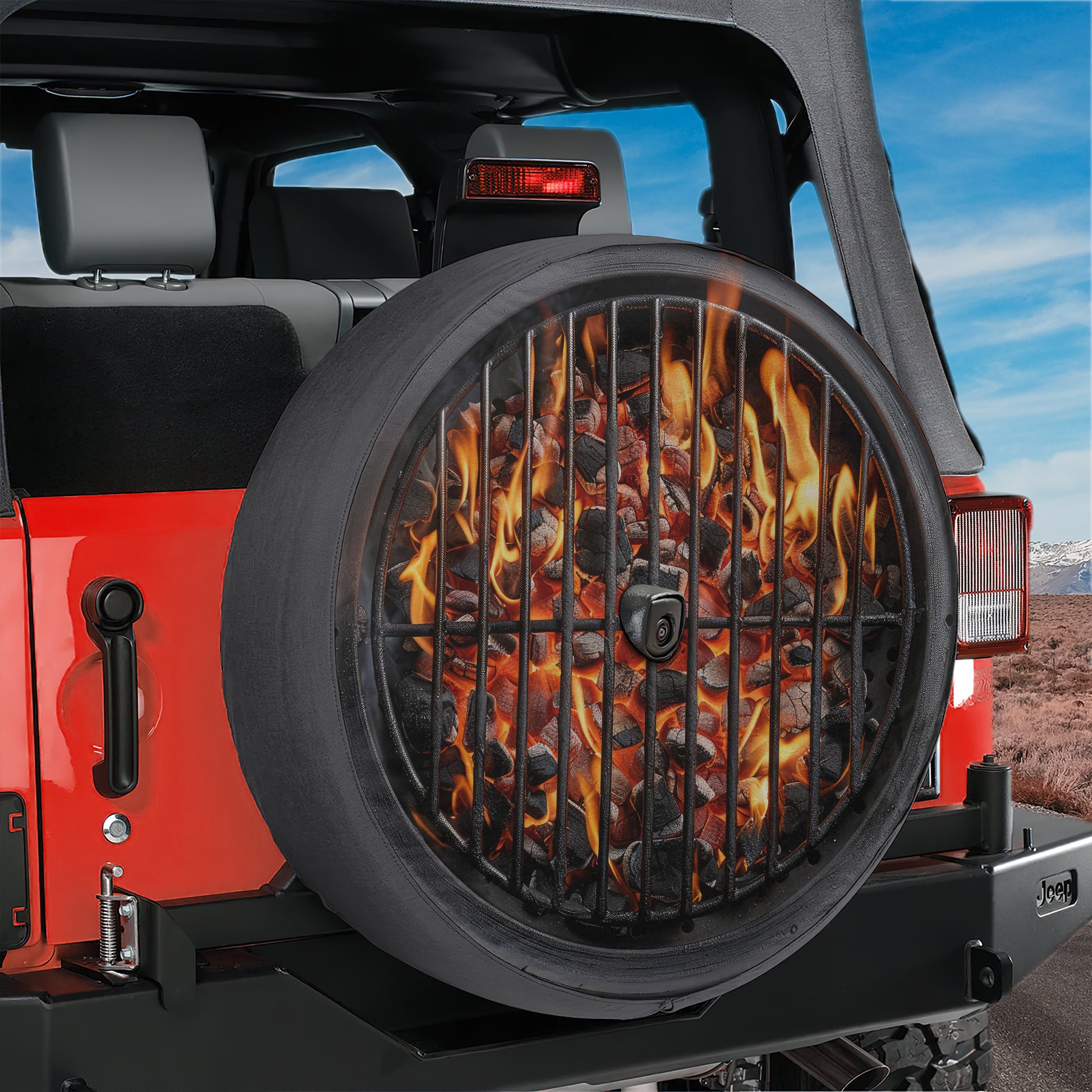 A red Jeep Wrangler with a large grill on the rear tire, which appears to be a fire pit or barbecue grill.