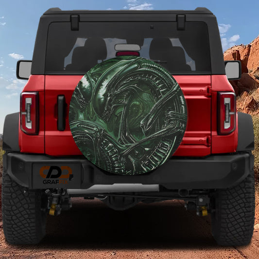 the rear of a red Jeep Wrangler with a large green alien-like design on the rear window.