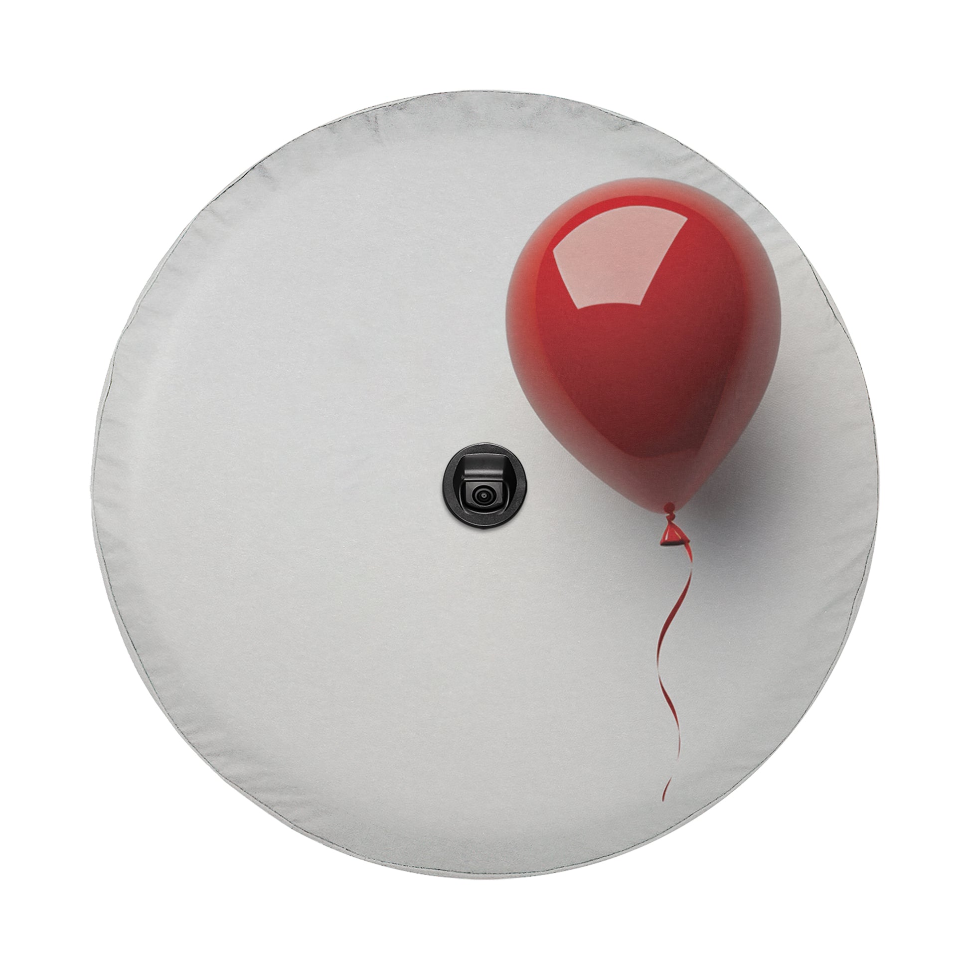 A red balloon is floating on a white surface, with a black object in the center of the image.