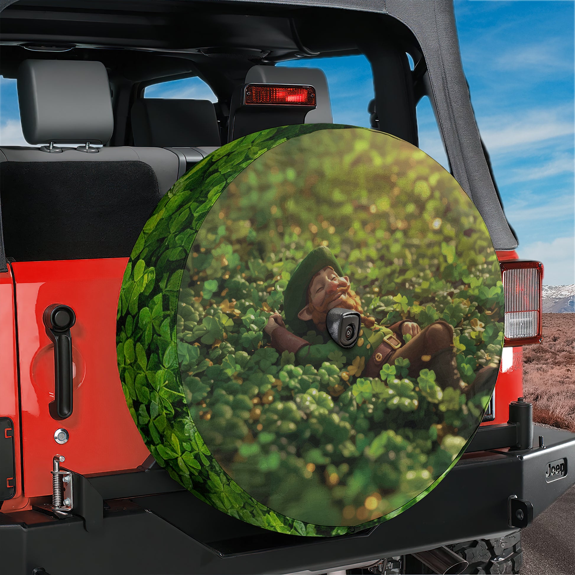 A large, round spare tire cover with a cartoon character on it, placed on the rear of a red Jeep.