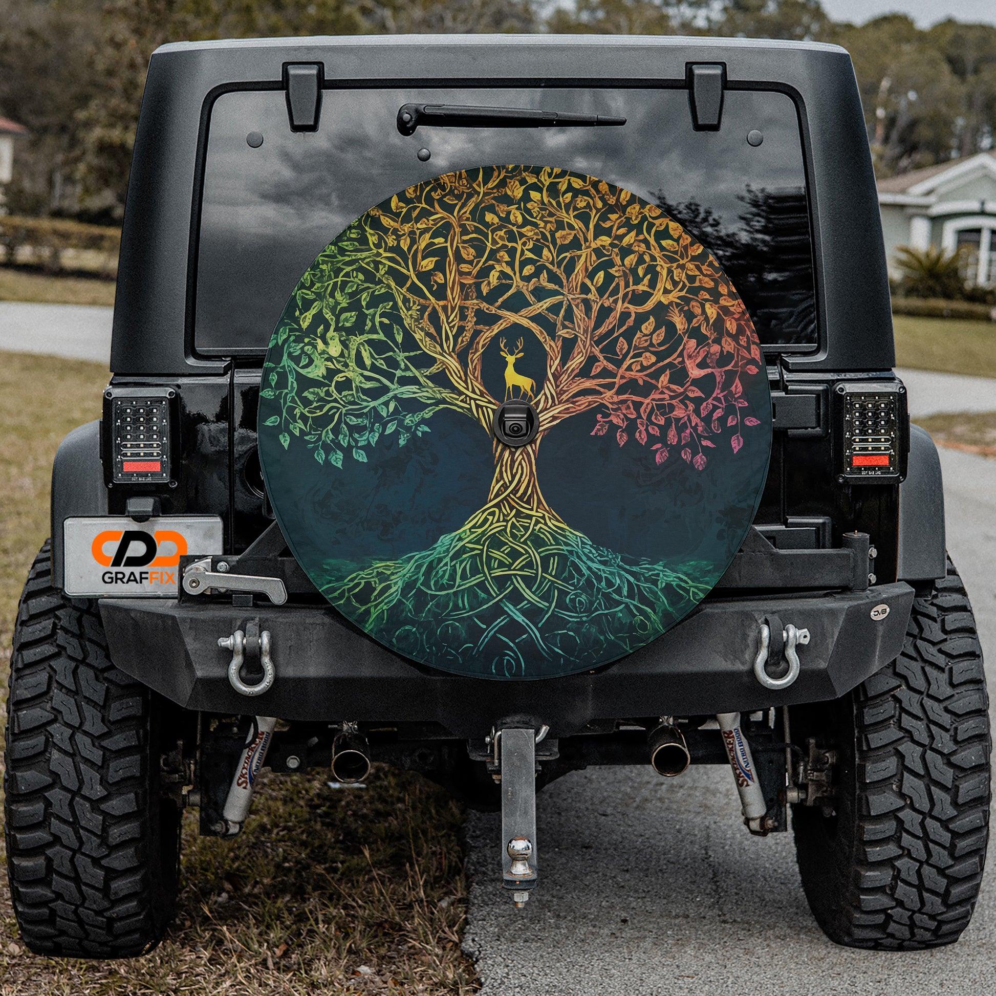 a jeep with a tree painted on the side of it