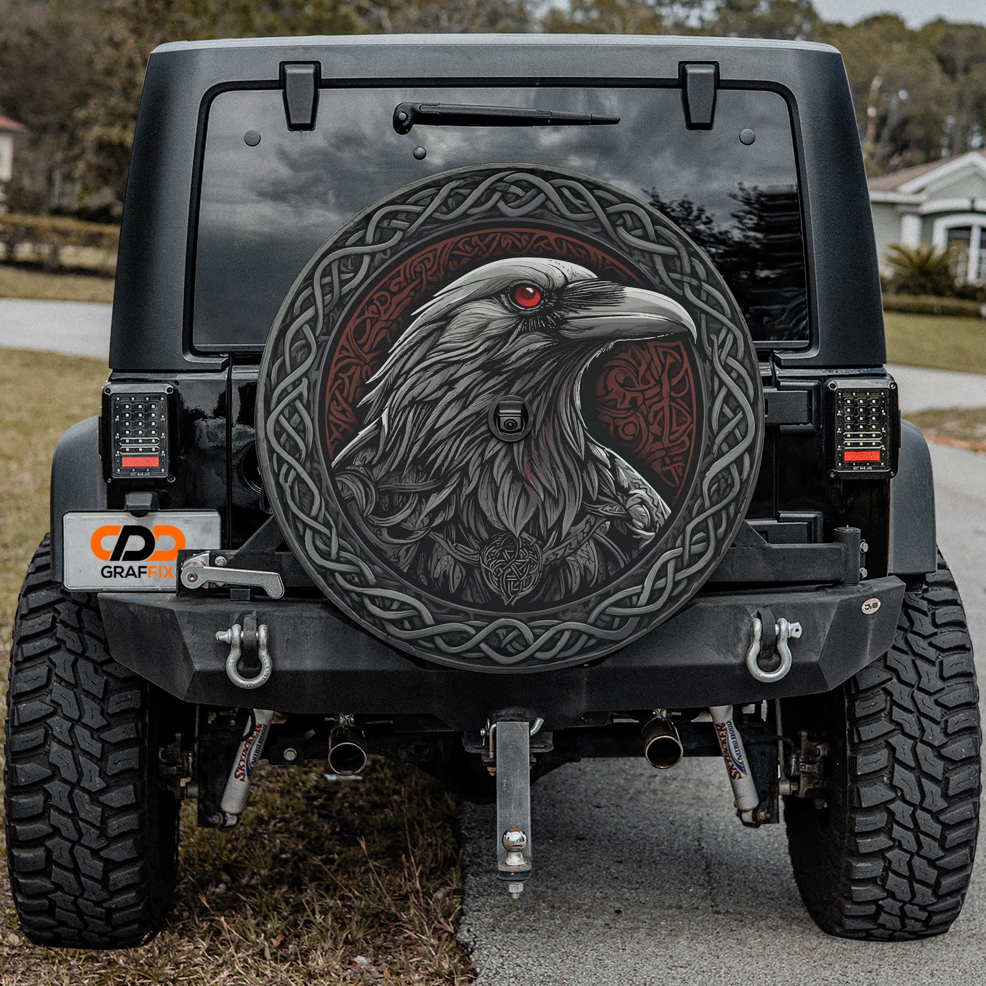 a black jeep with a picture of an eagle on it