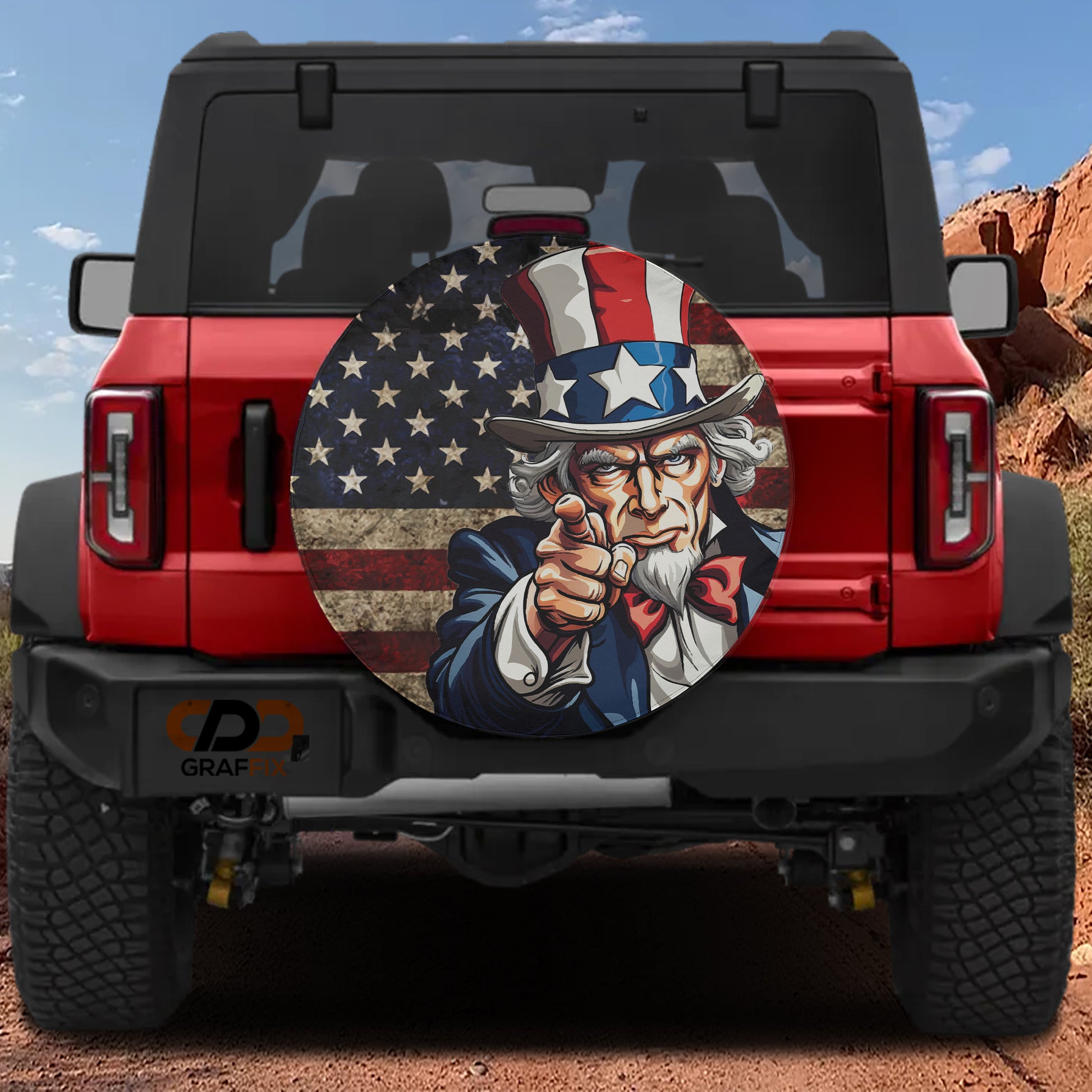 A red Jeep Wrangler with a large American flag decal on the rear window.