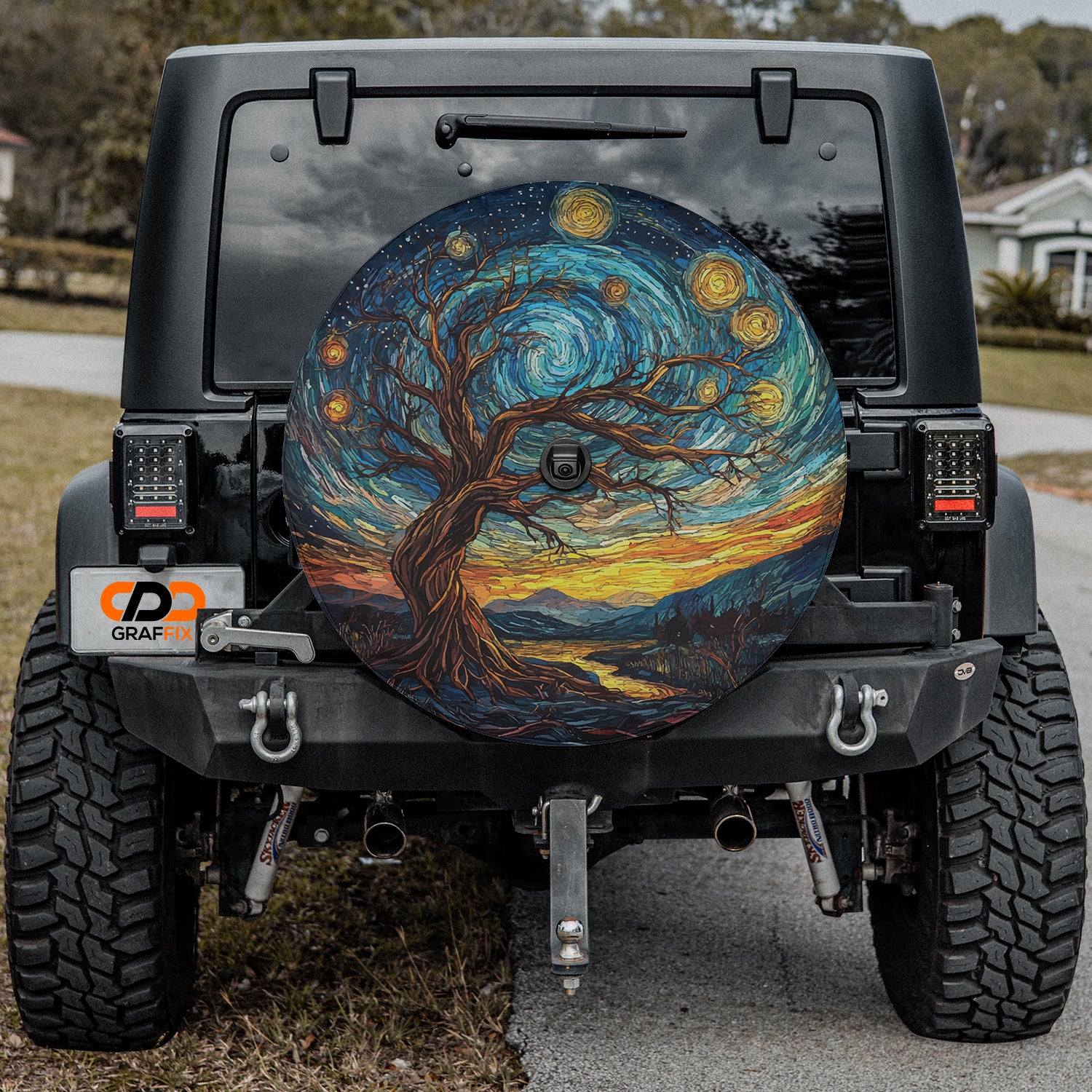 a jeep with a tree painted on the back of it