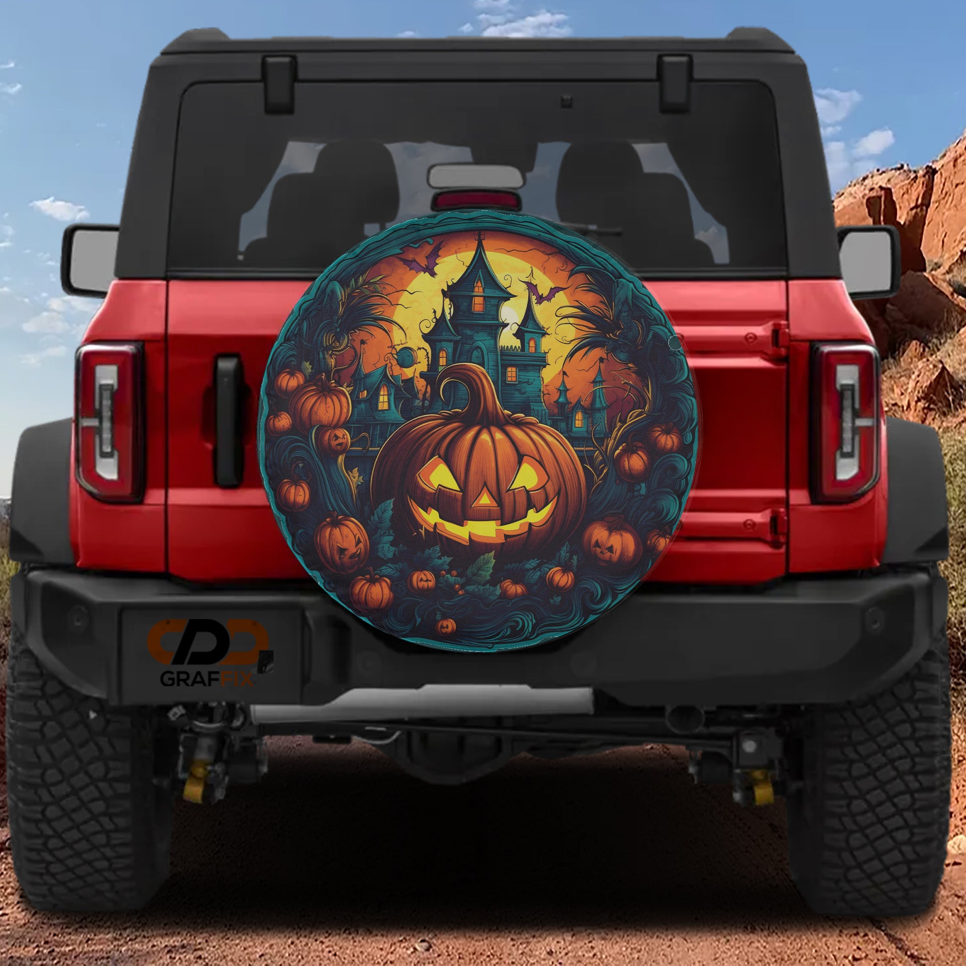a red Jeep Wrangler with a Halloween-themed spare tire cover on the rear window.