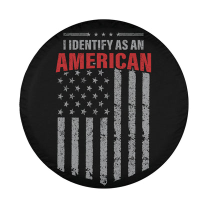 a black wheel cover with a graphic design that includes the American flag and the text "I identify as an American".