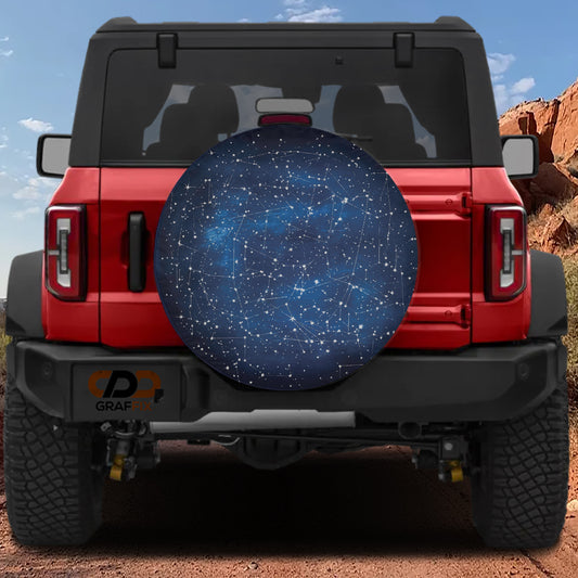 the rear view of a red Jeep Wrangler with a starry night sky design on the spare tire cover.