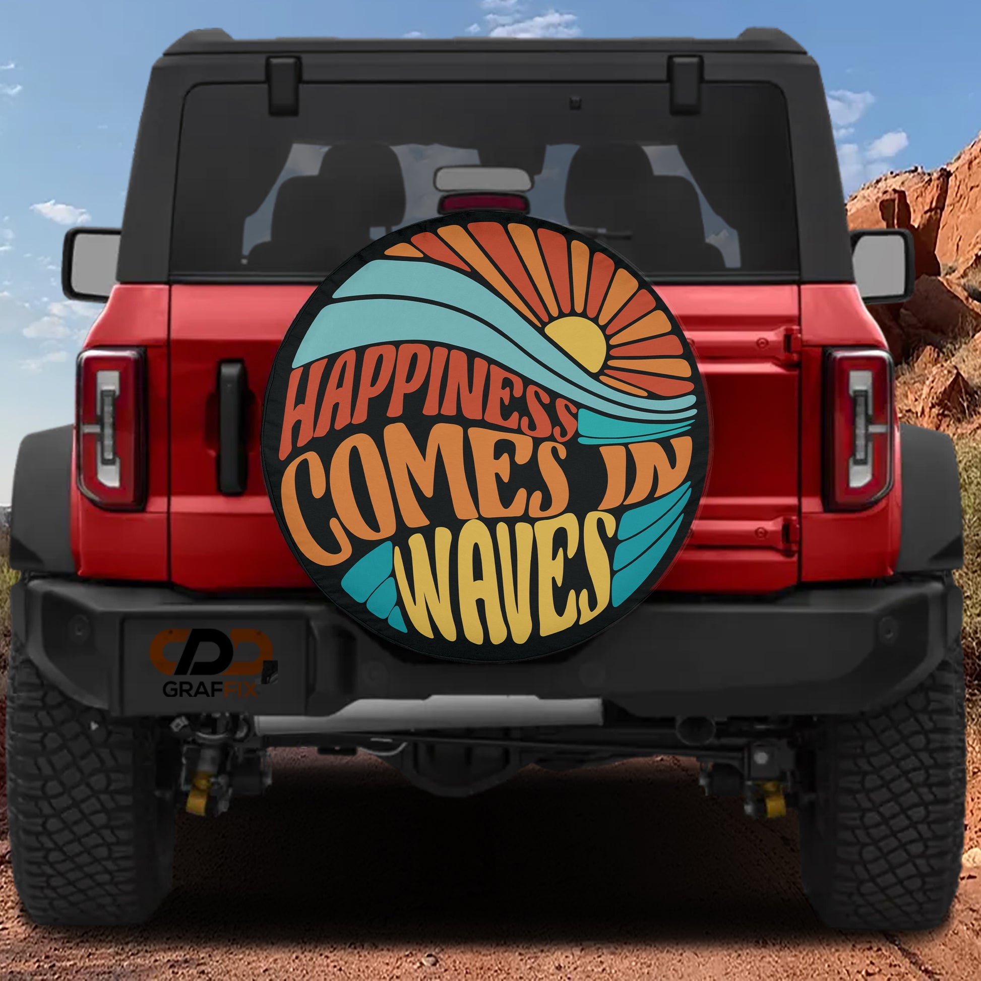 a red Jeep Wrangler with a large surfboard-shaped spare tire attached to the rear of the vehicle.